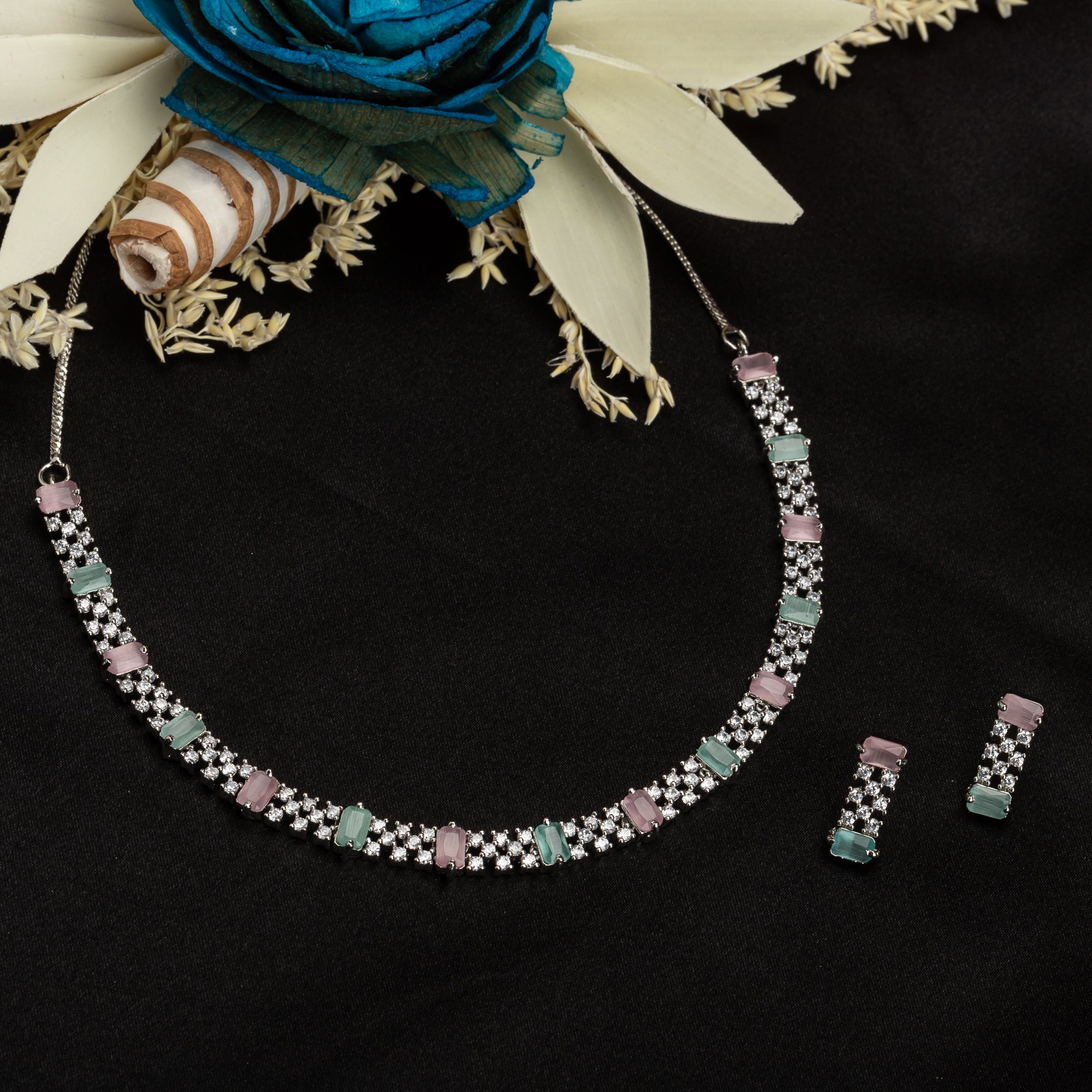 "Vibrant pink and green zircon necklace offers an eye-catching, colorful design."