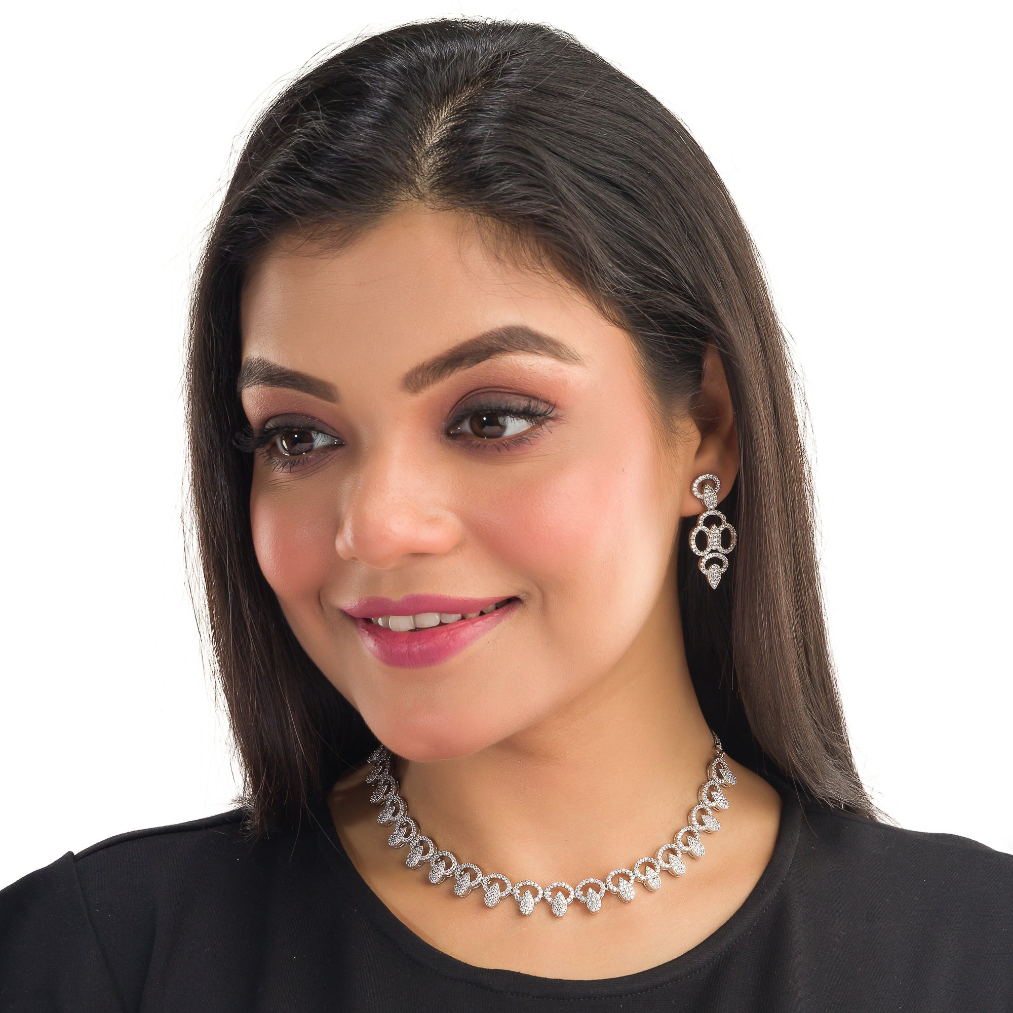 "Zircon necklace with large stone drop adds dramatic sparkle and elegance."