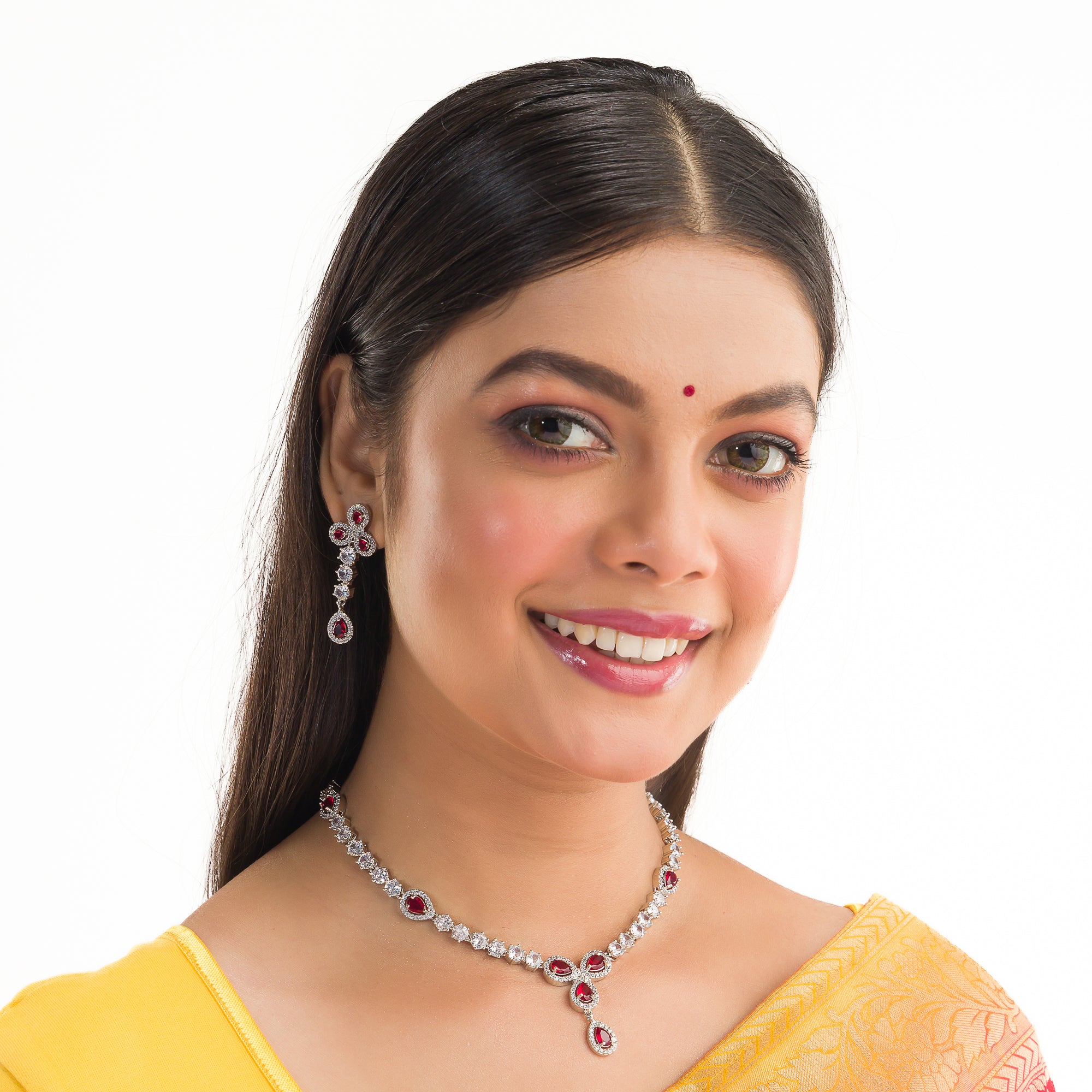 "Silver zircon necklace with maroon stone offers sophisticated, striking contrast."