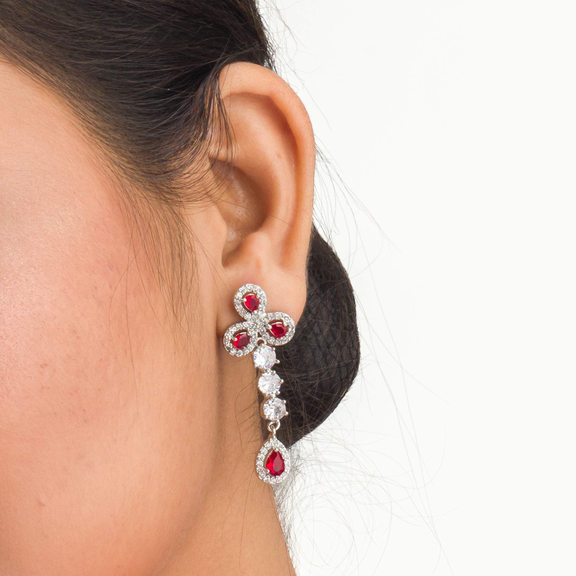 "Silver zircon necklace with maroon stone offers sophisticated, striking contrast."