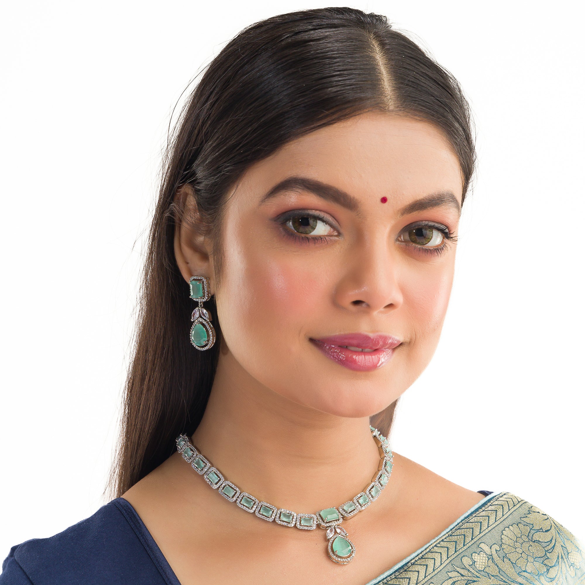 "Captivating green zircon necklace adds vibrant elegance for a festival-ready look."