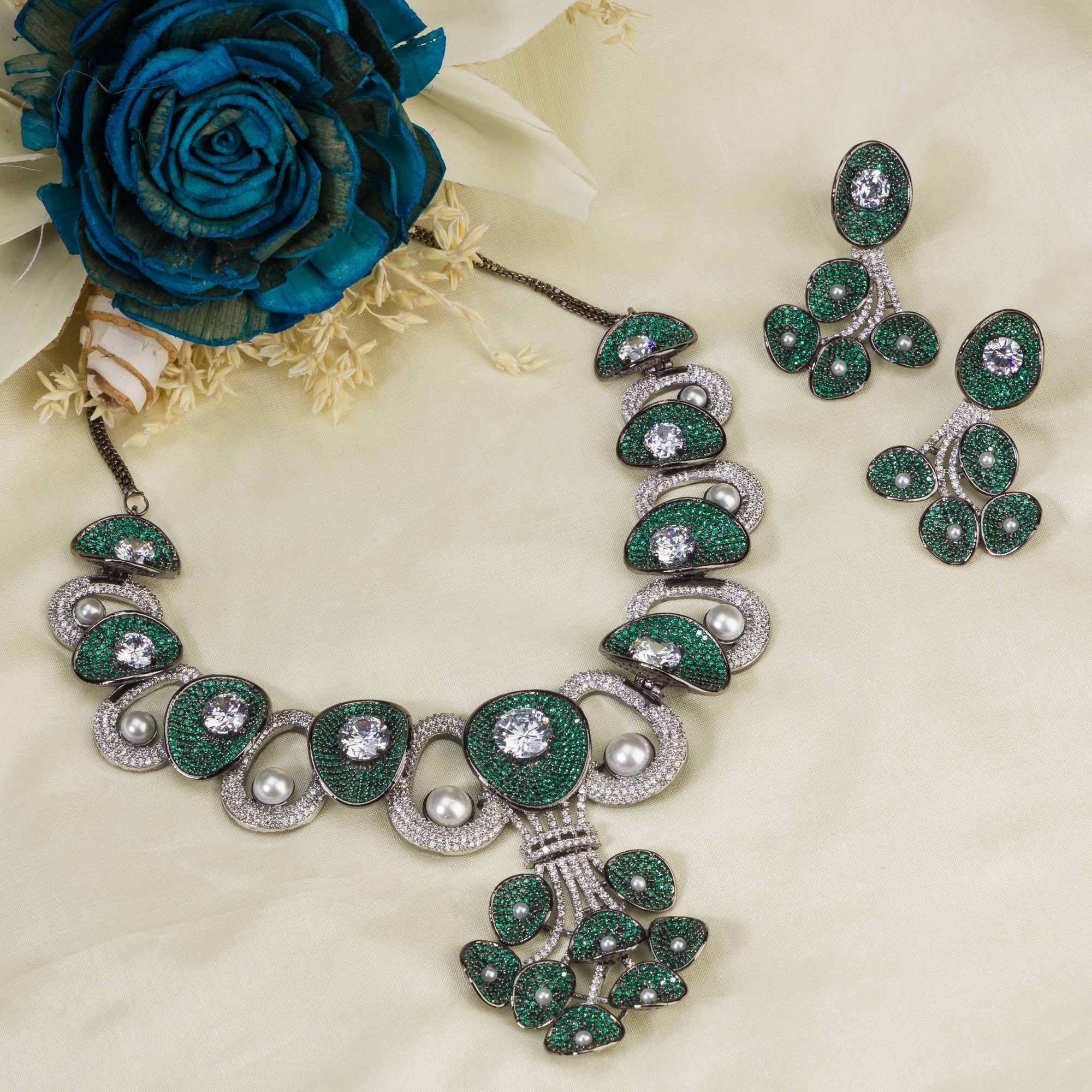 Tree-shaped necklace with green and white zircons brings a unique, elegant charm to any party look.