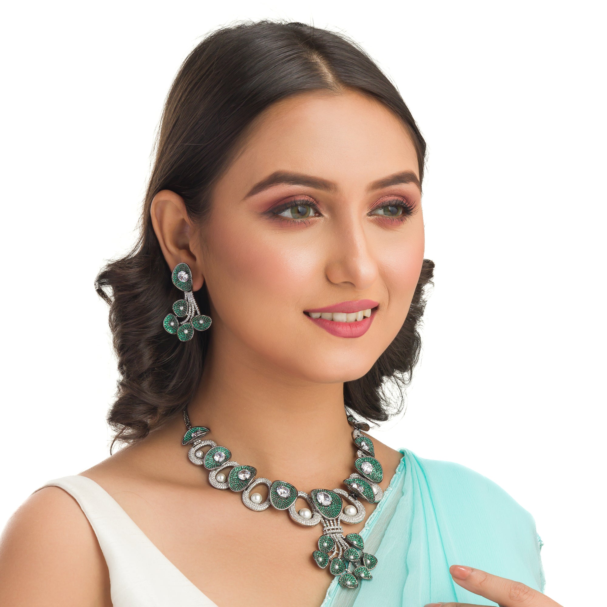 Tree-shaped necklace with green and white zircons brings a unique, elegant charm to any party look.