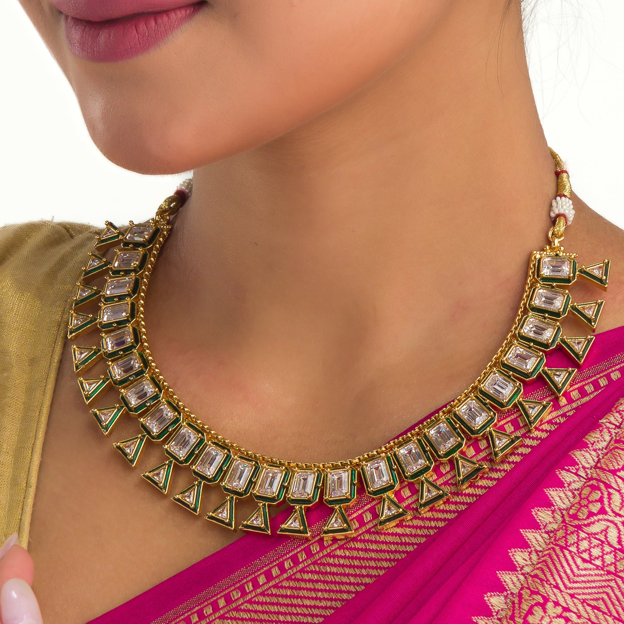 White zircon stone with a green border adds a bold and striking touch of elegance.