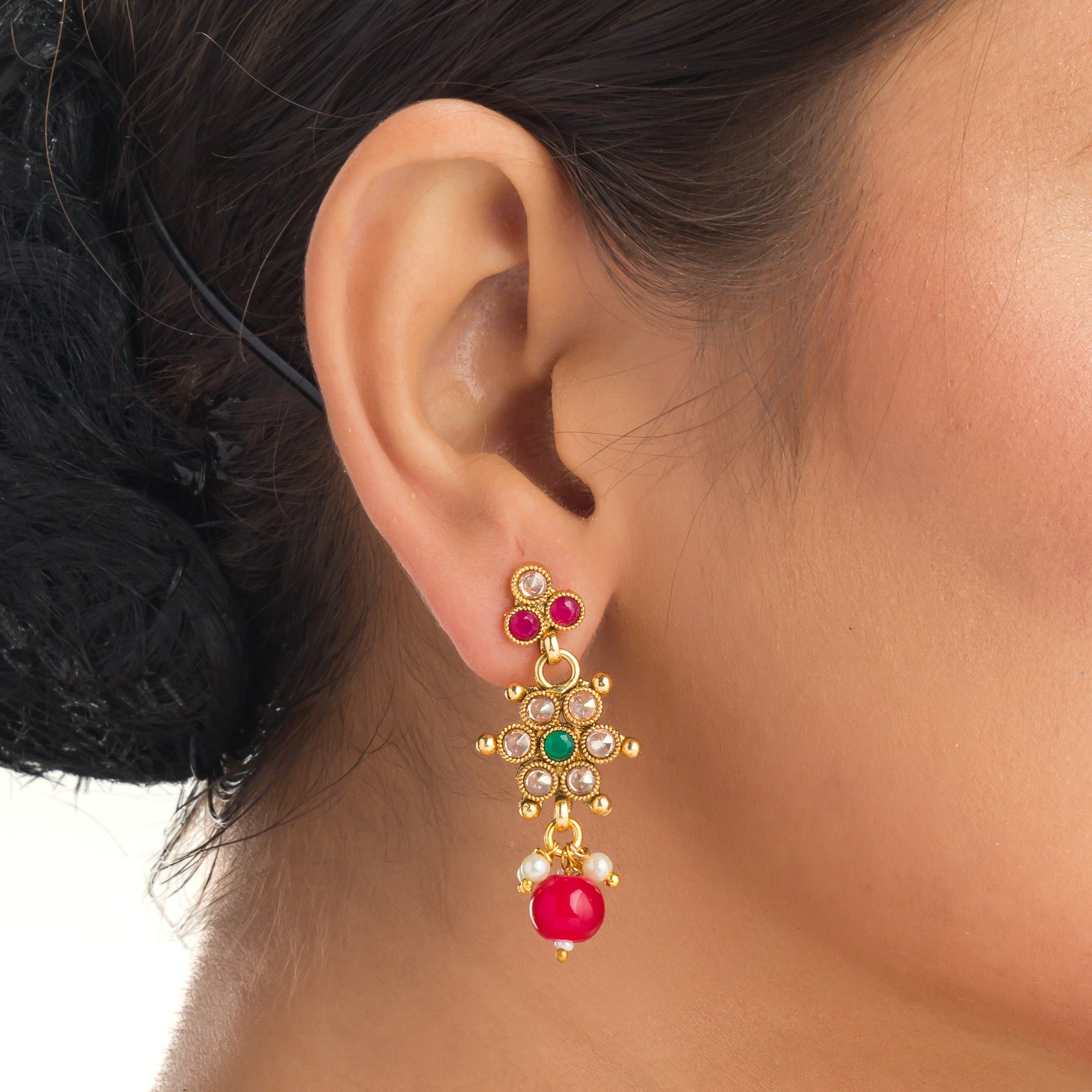 Gold-tone necklace with matching Maang Tikka offers a traditional and elegant festival ensemble.