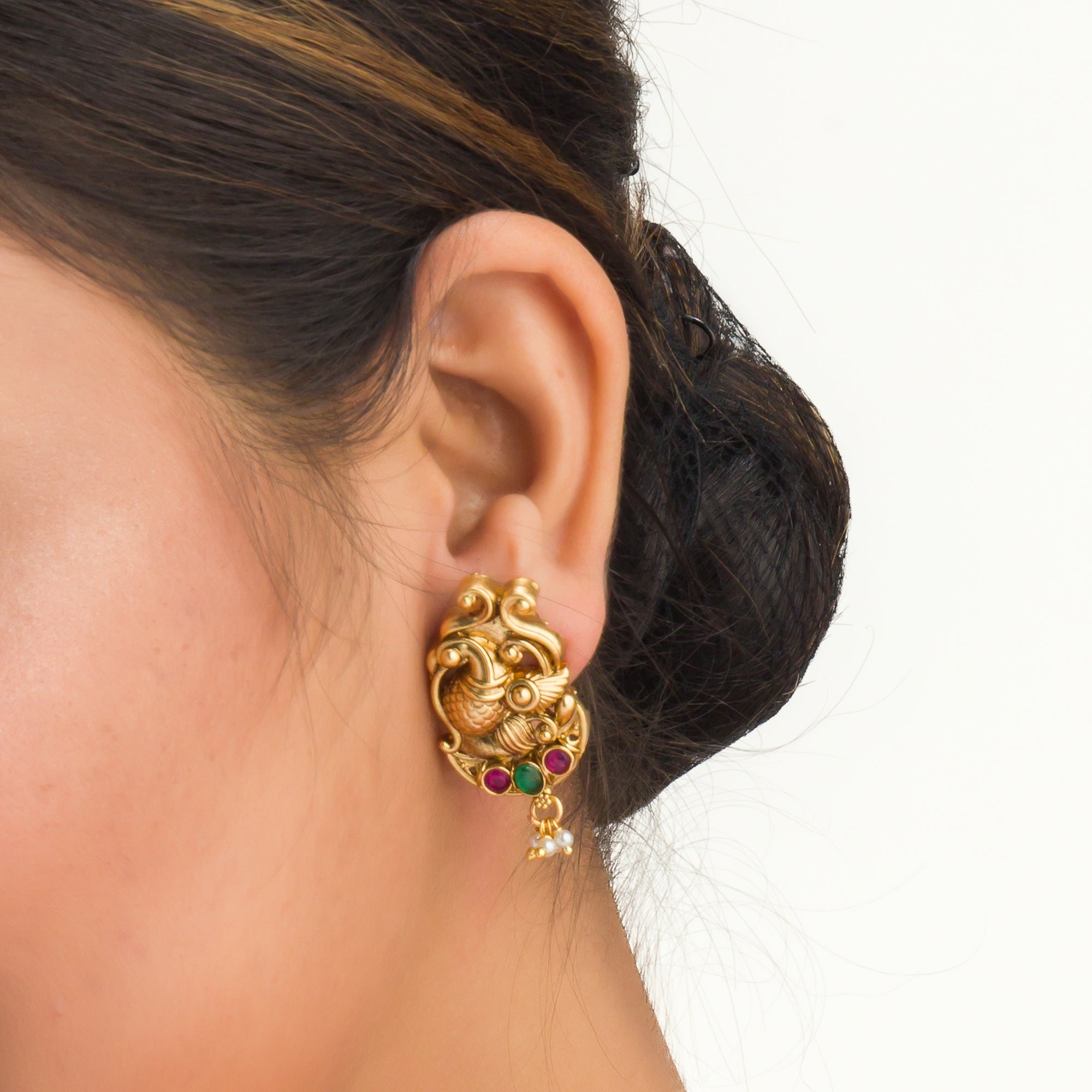 Vibrant gold-tone necklace with red, green stones, and white pearls for a stunning party look.