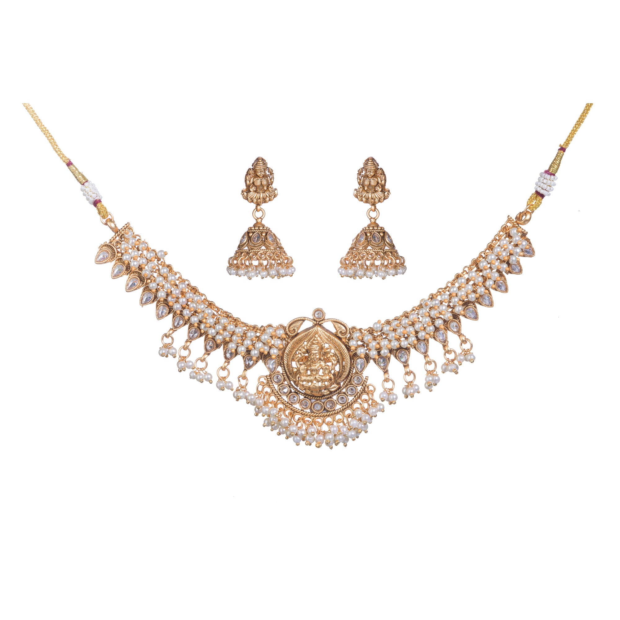 Graceful temple necklace with white pearls adds a touch of classic festival sophistication.