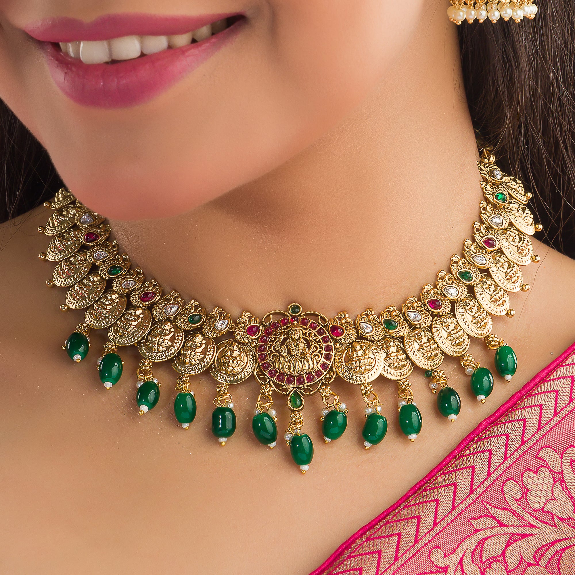 Temple necklace with green Kundan stones radiates vibrant, traditional festival elegance.