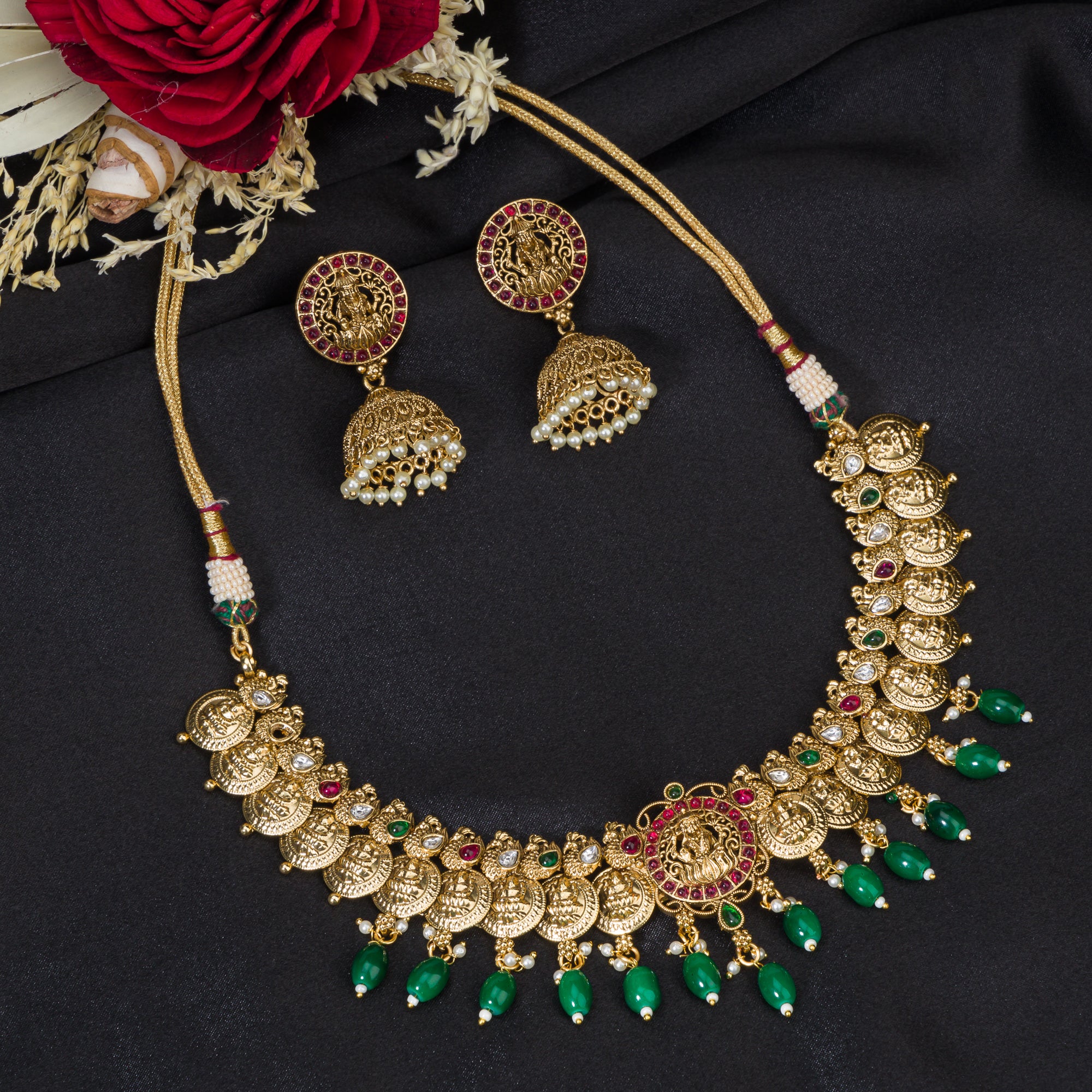 Temple necklace with green Kundan stones radiates vibrant, traditional festival elegance.