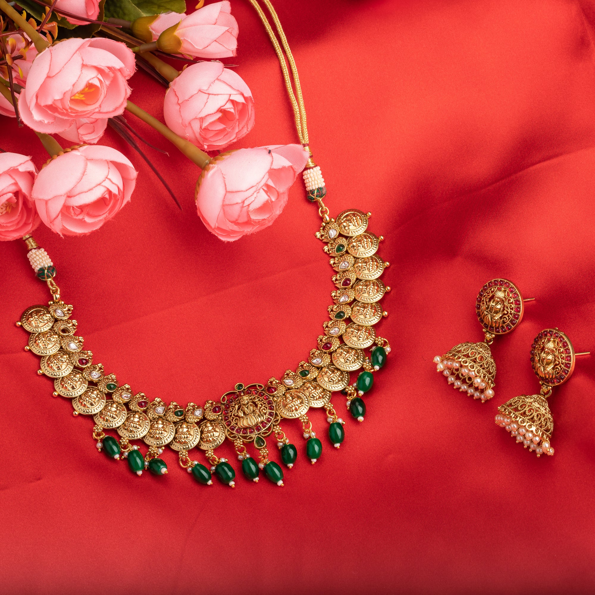 Temple necklace with green Kundan stones radiates vibrant, traditional festival elegance.