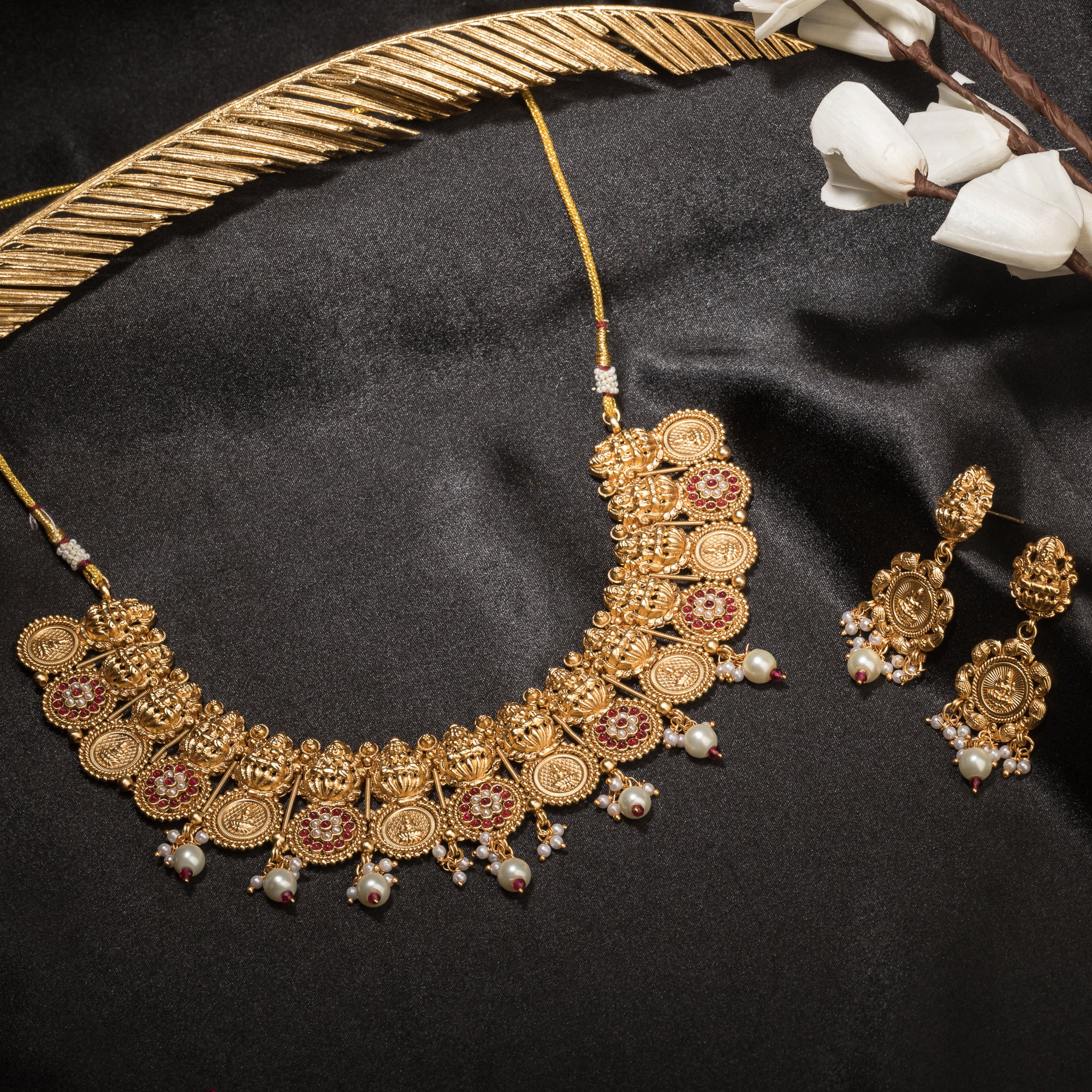 Intricate coin-style temple necklace highlights classic craftsmanship and timeless tradition.