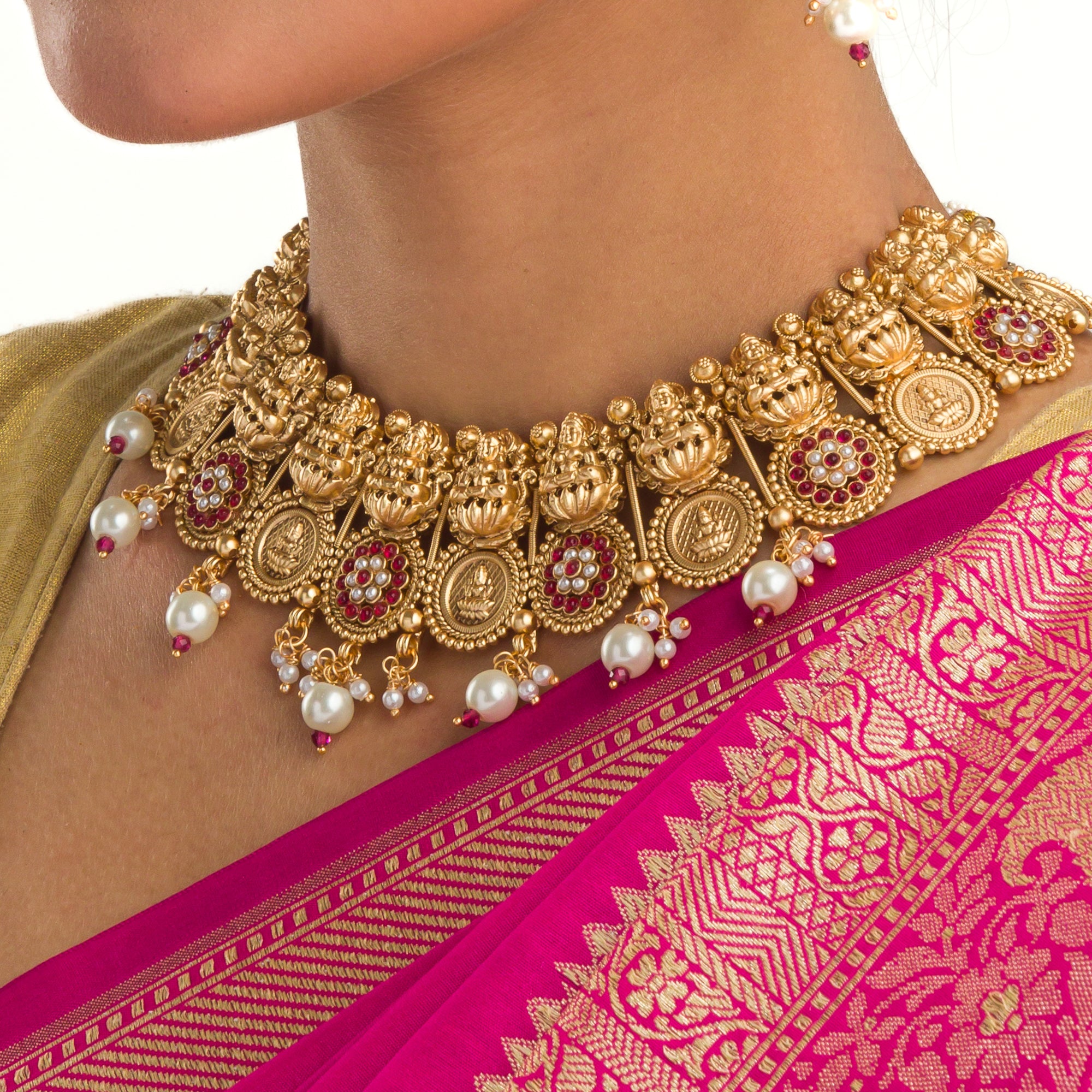 Intricate coin-style temple necklace highlights classic craftsmanship and timeless tradition.