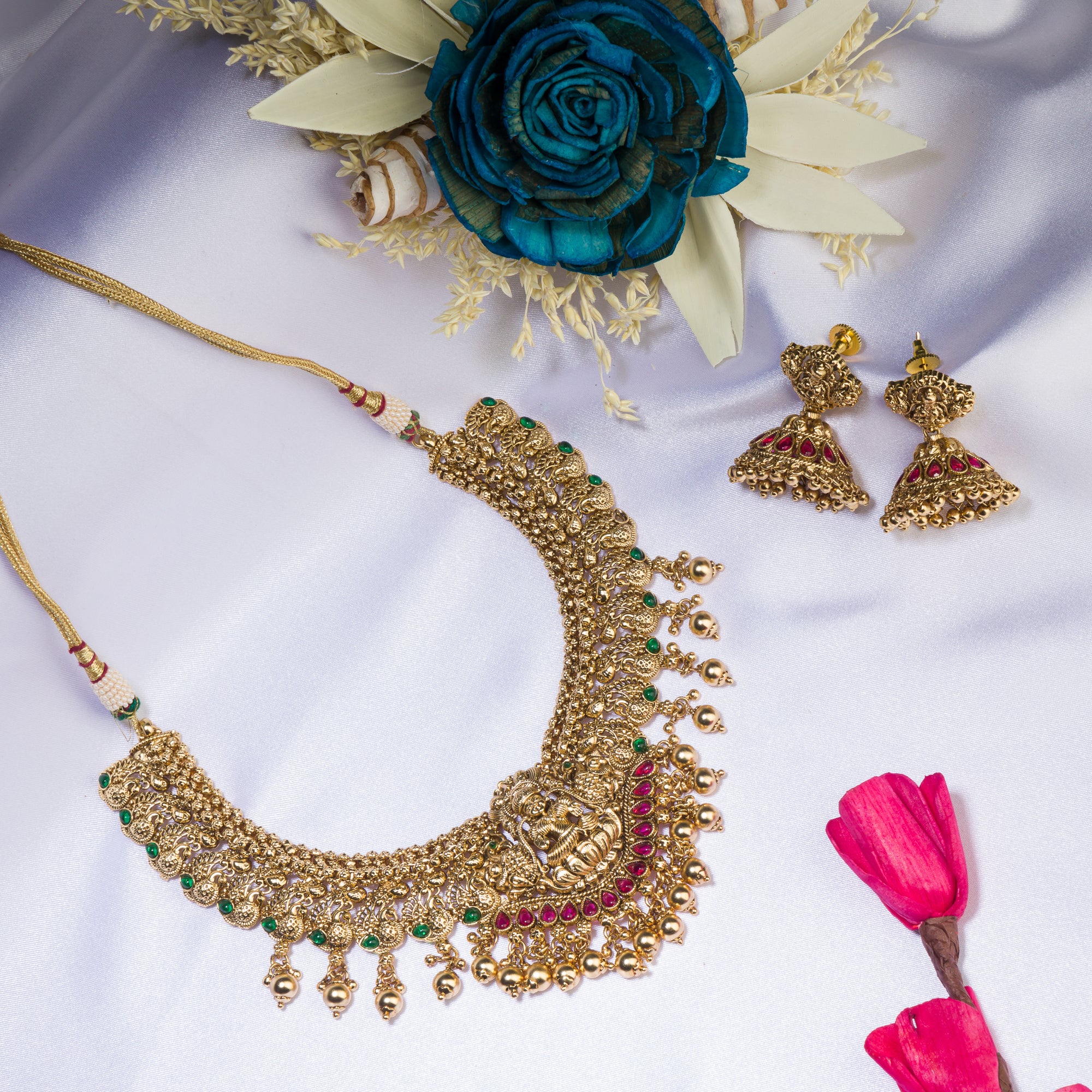 Temple necklace with intricate craftsmanship adds timeless elegance to your festive ensemble.
