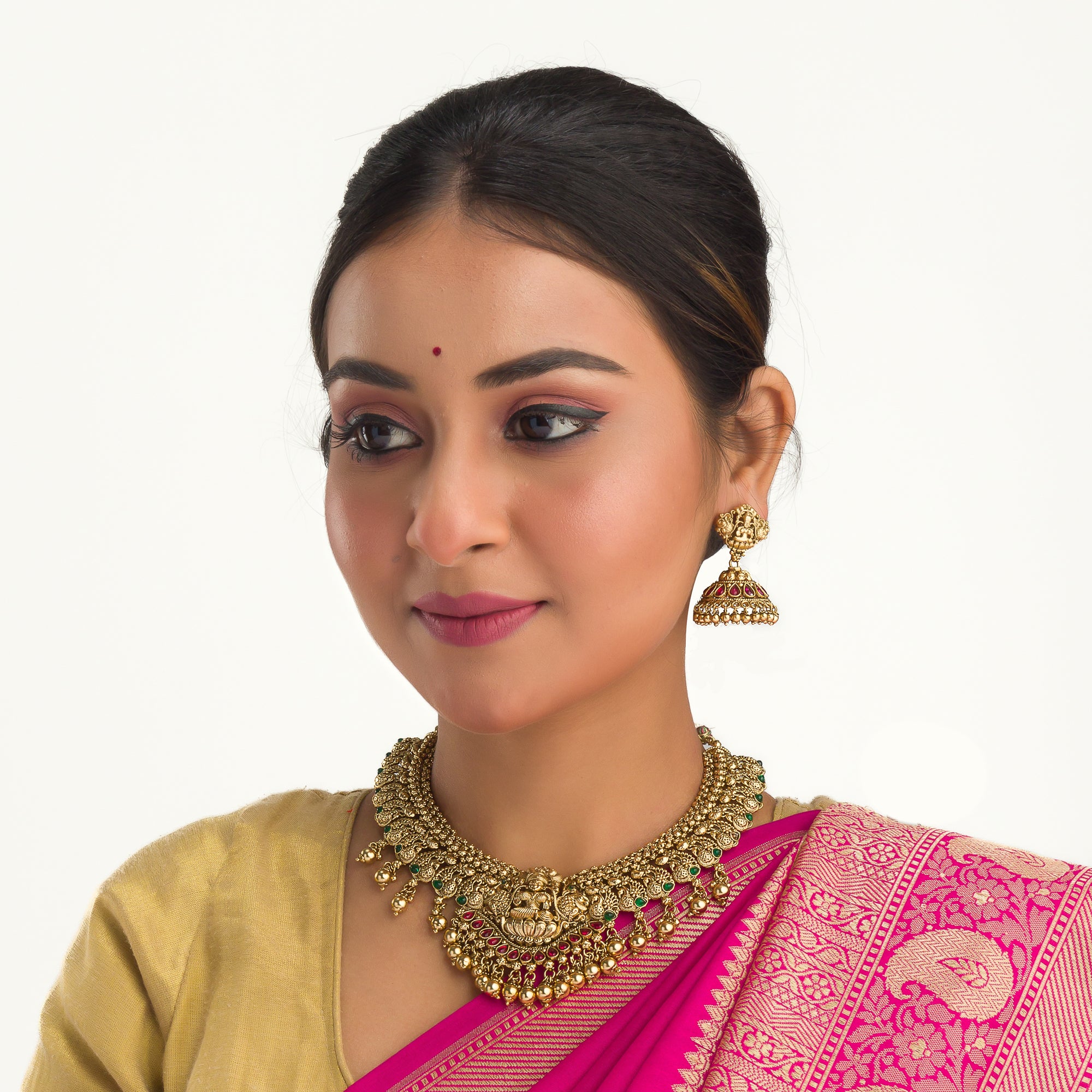 Temple necklace with intricate craftsmanship adds timeless elegance to your festive ensemble.