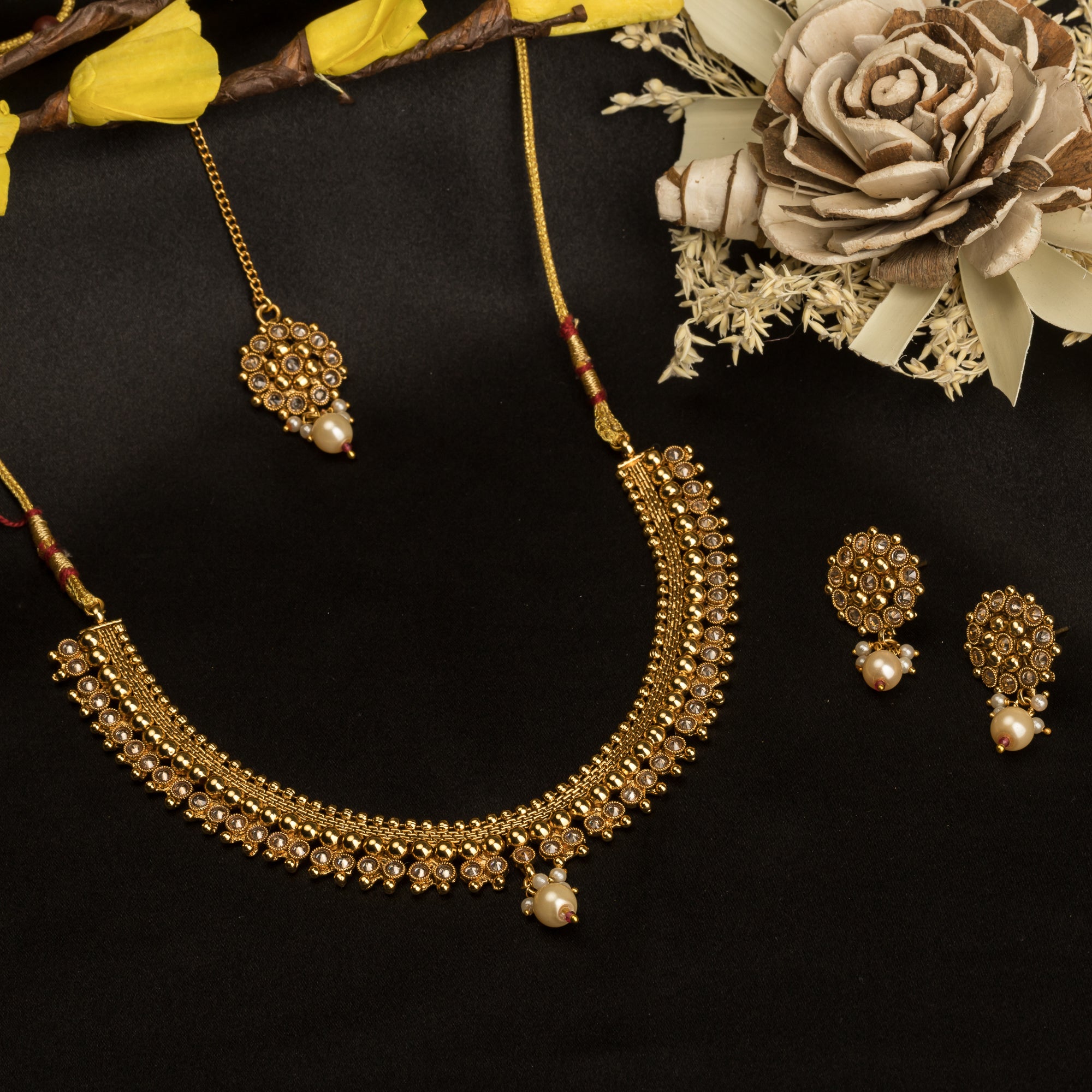 Sophisticated gold-tone choker exudes timeless charm for festive occasions.