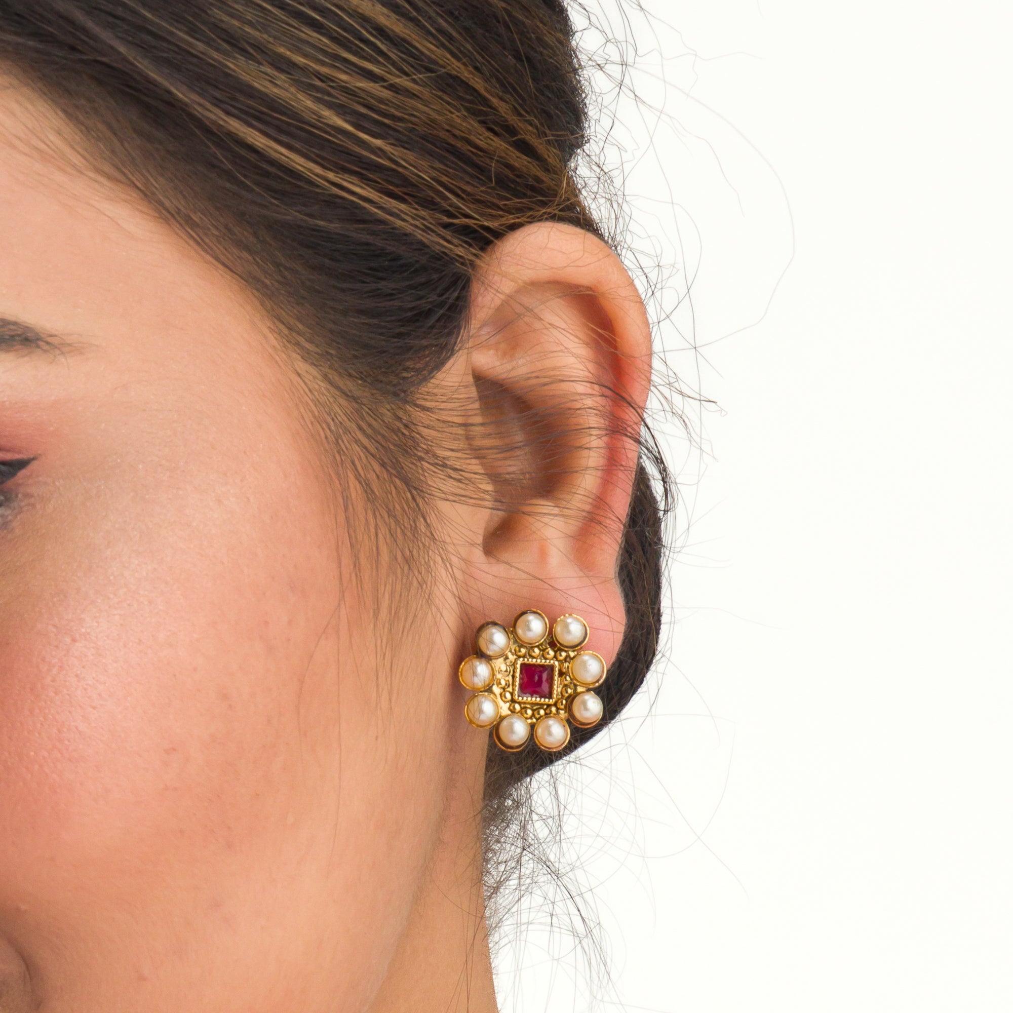 Short necklace with vibrant multi-color stones brings playful flair to festive attire.