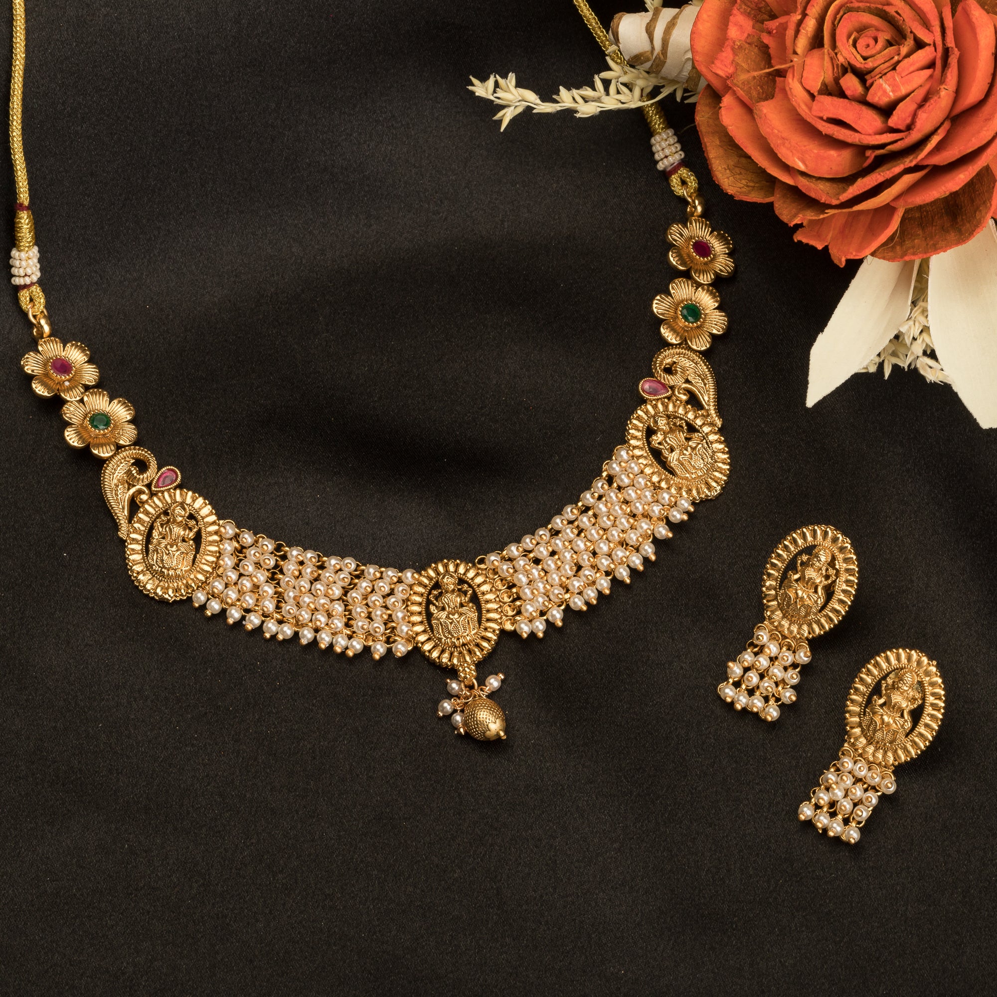 Temple necklace with intricate craftsmanship adds timeless elegance to your festive ensemble.