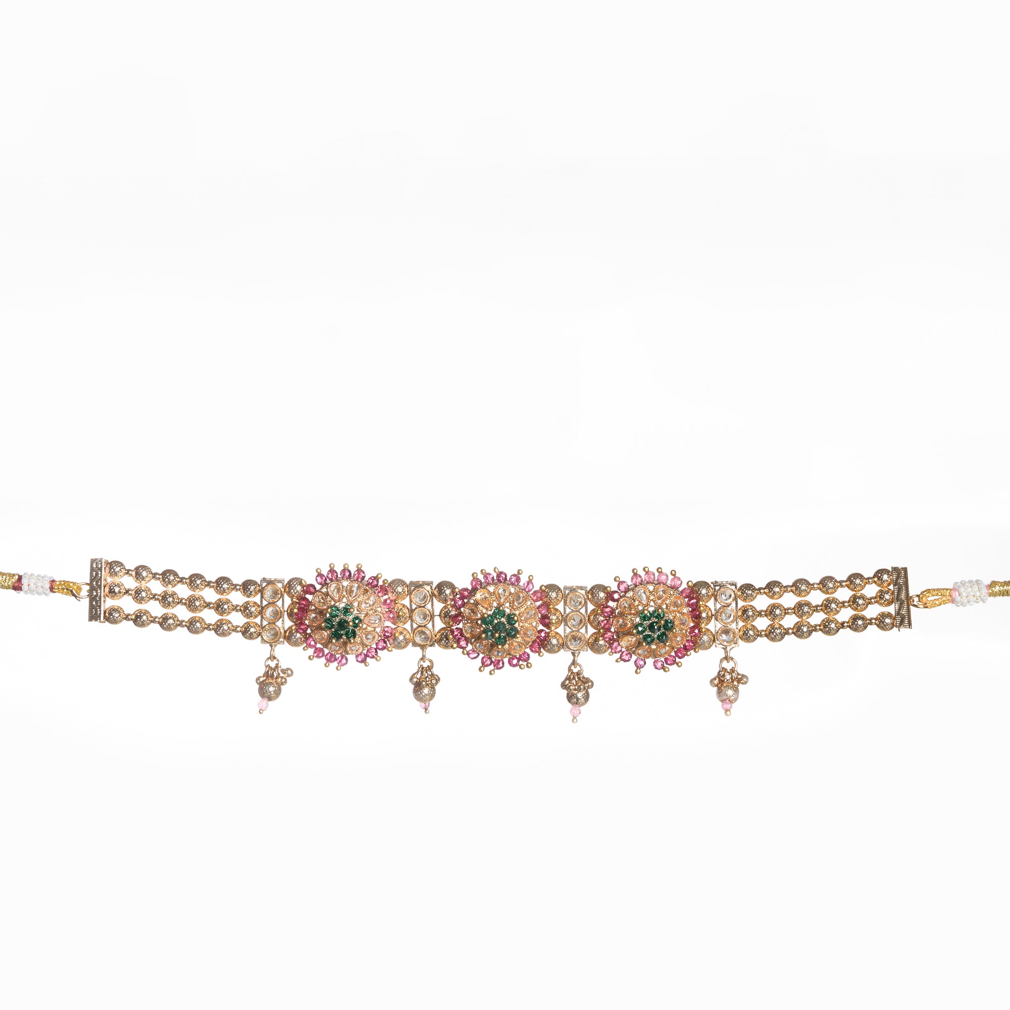 Kundan choker with maroon and green stones offers a regal and vibrant festival look.