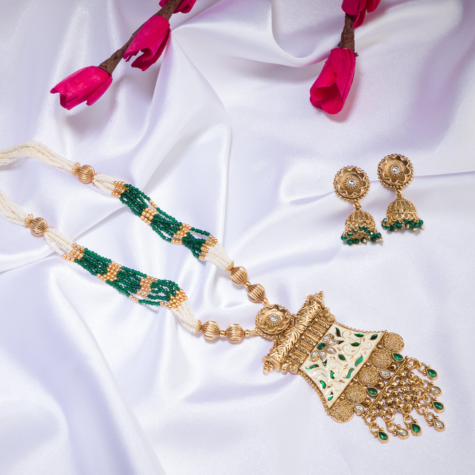 Long temple necklace with maroon pearls radiates classic festival opulence.