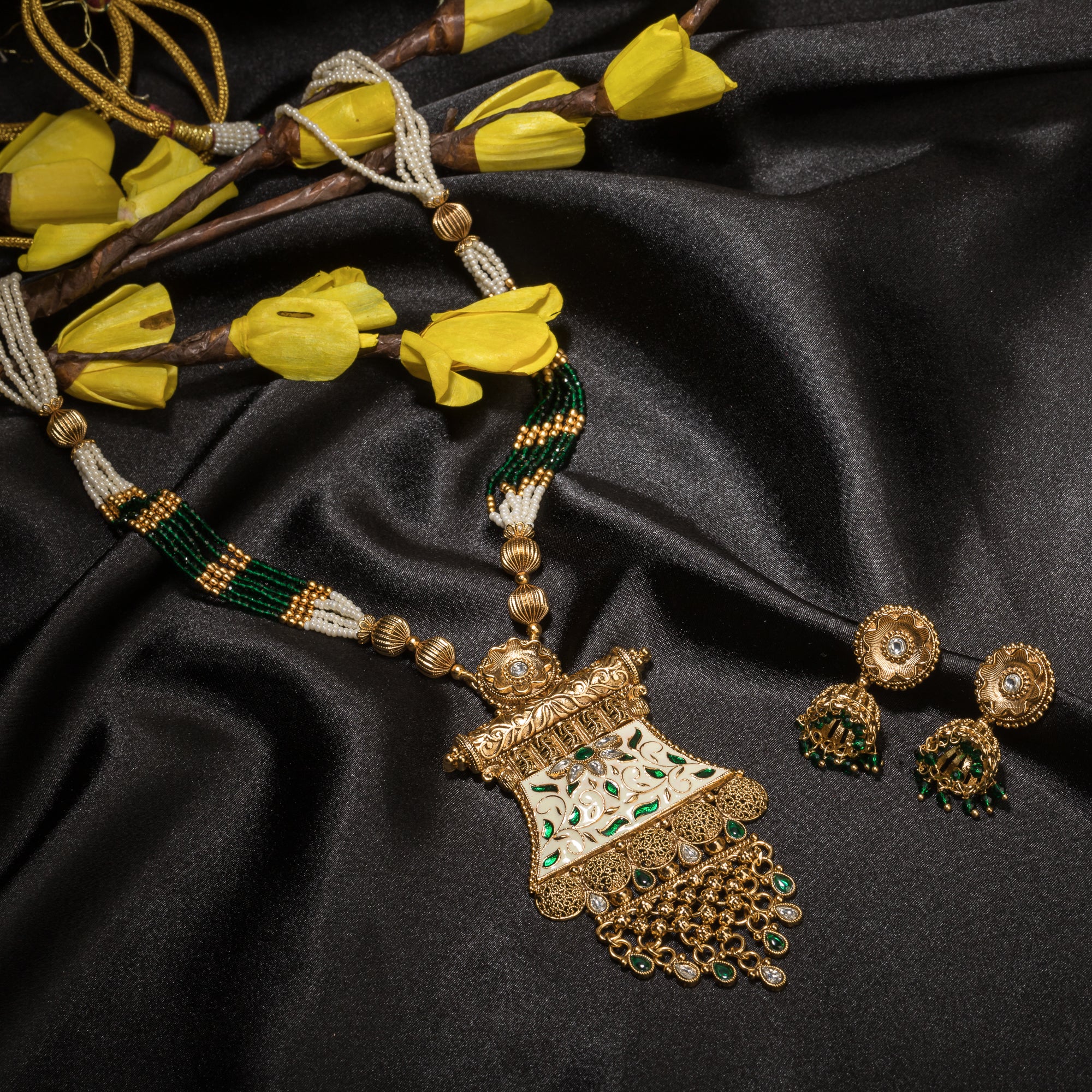 Long temple necklace with maroon pearls radiates classic festival opulence.