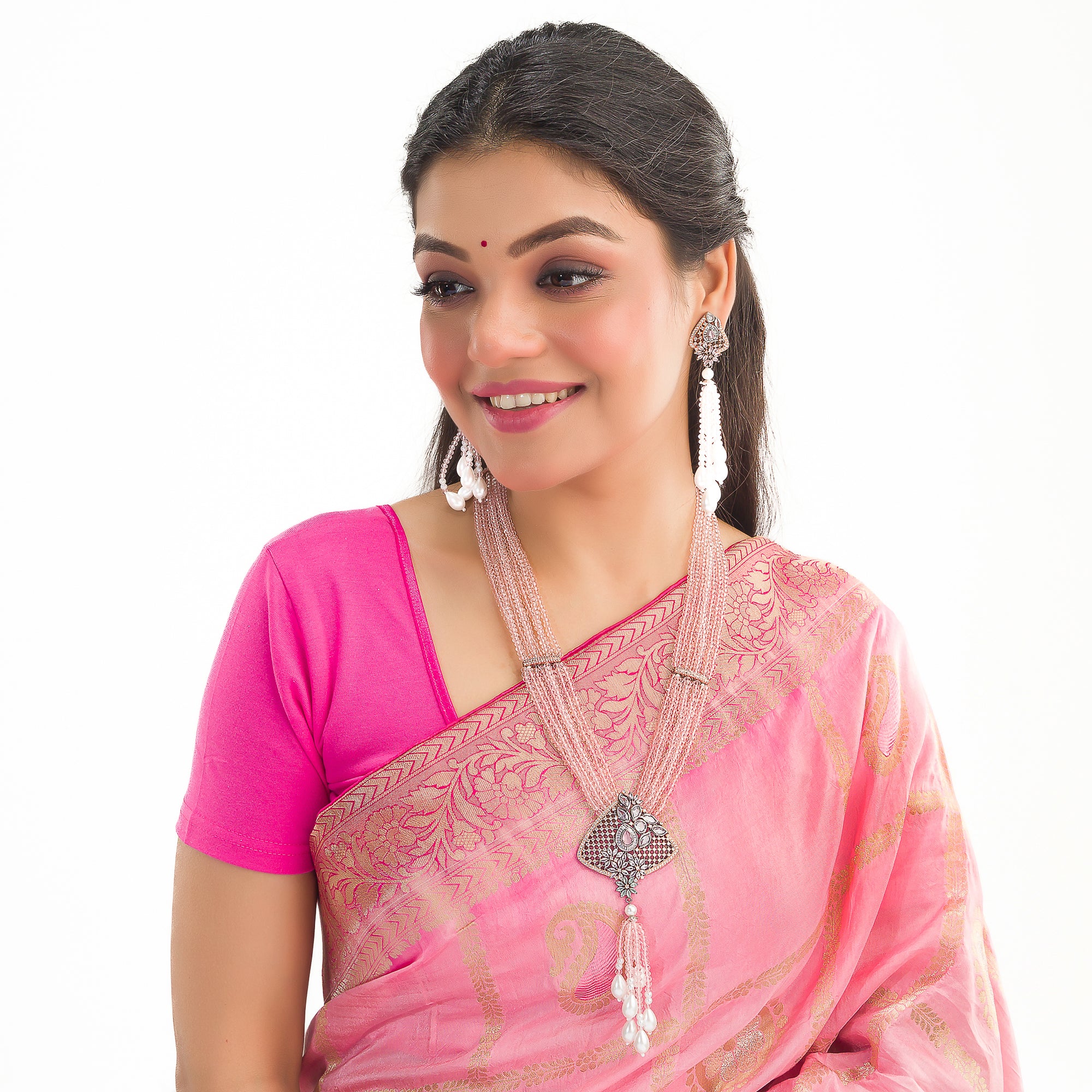 A short necklace with vibrant multi-colour stones brings playful flair to festive attire.