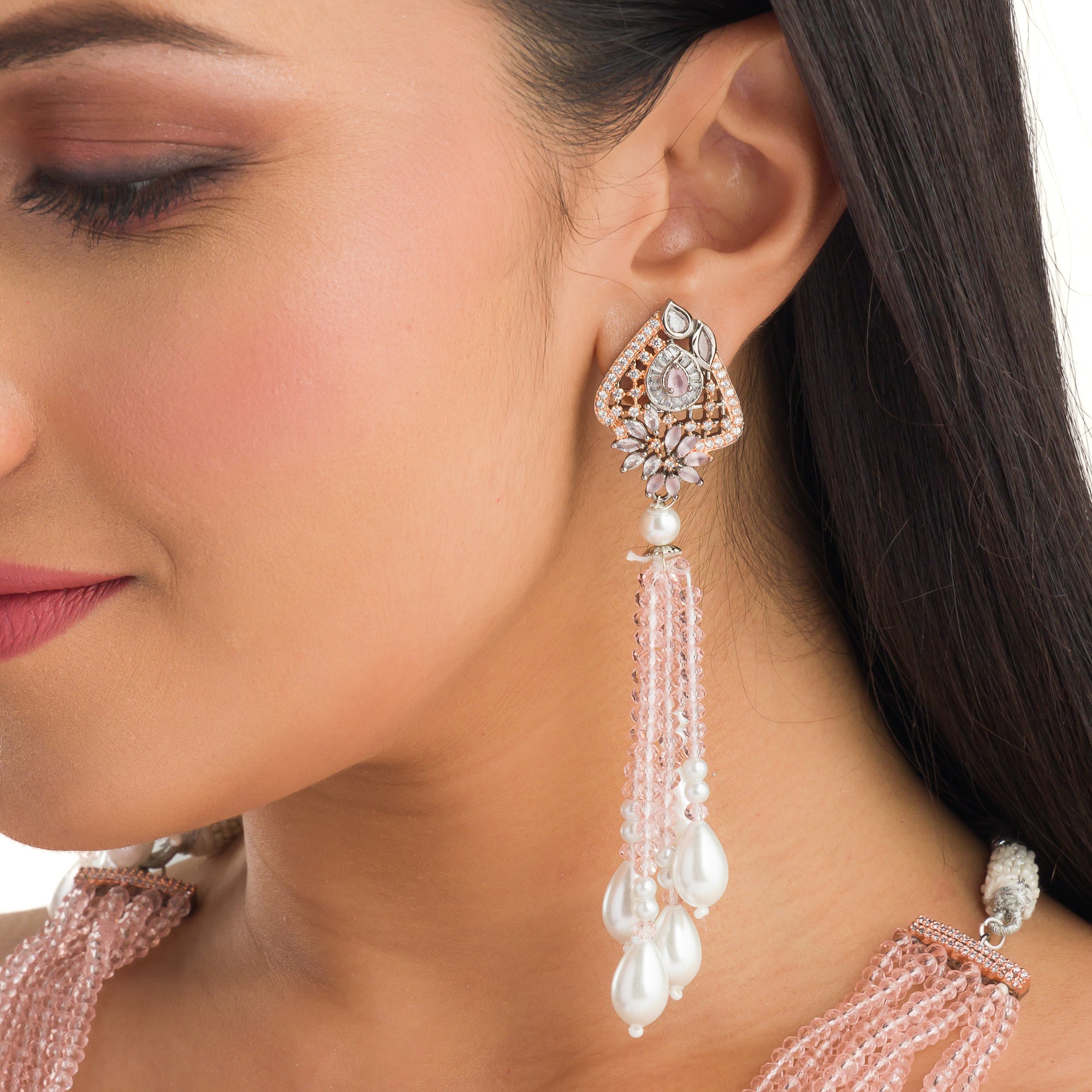 A short necklace with vibrant multi-colour stones brings playful flair to festive attire.