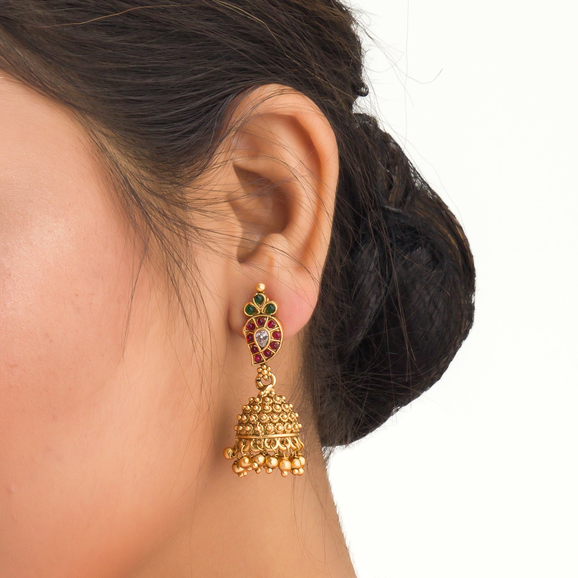 Gold long necklace with multi-color stones exudes vibrant elegance for a festive celebration.