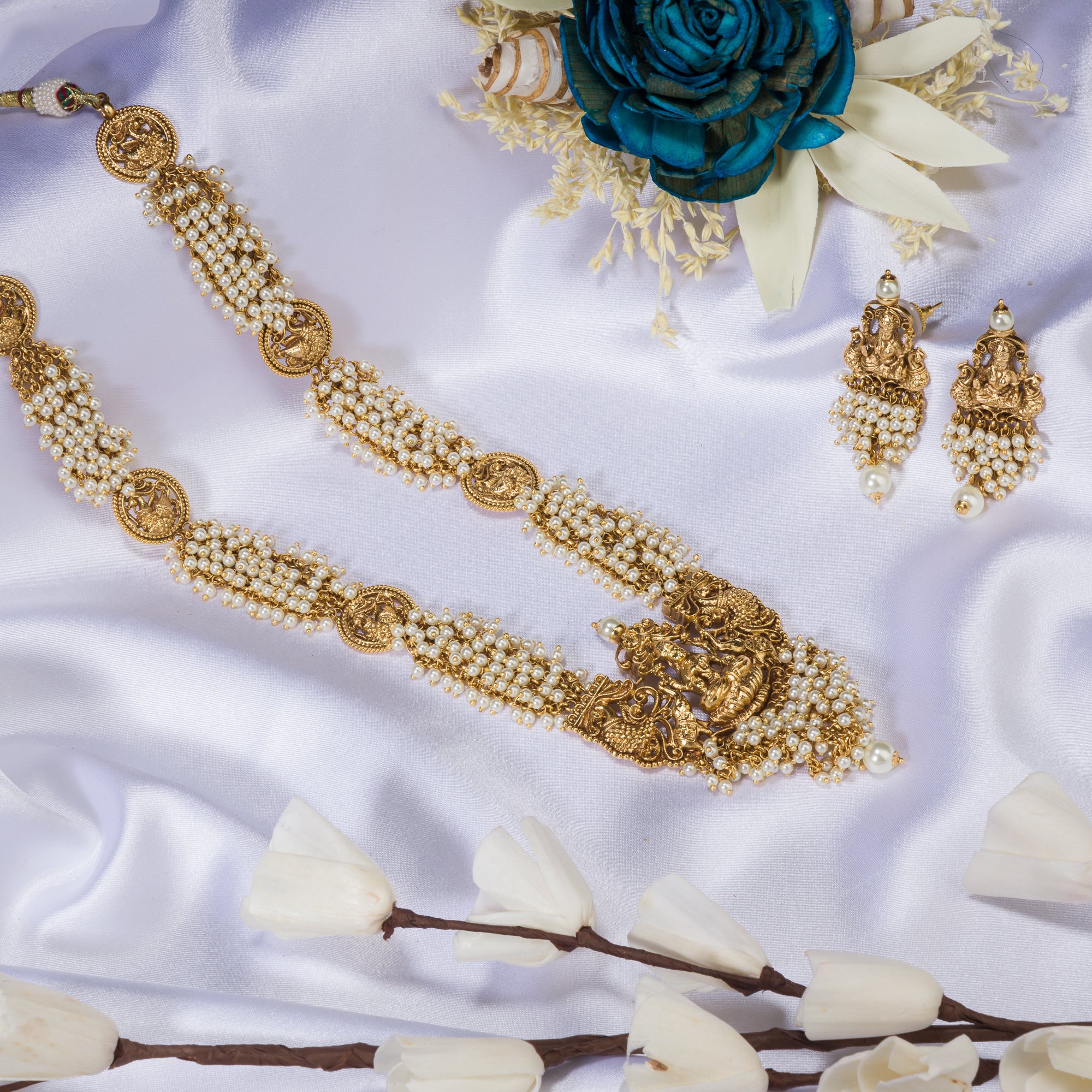 Luxurious temple long necklace with white pearls radiates opulence and refined elegance for festivals.