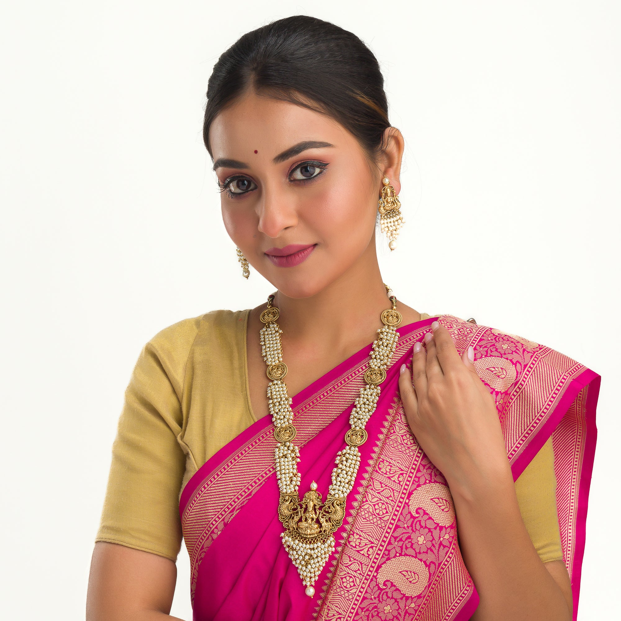 Luxurious temple long necklace with white pearls radiates opulence and refined elegance for festivals.