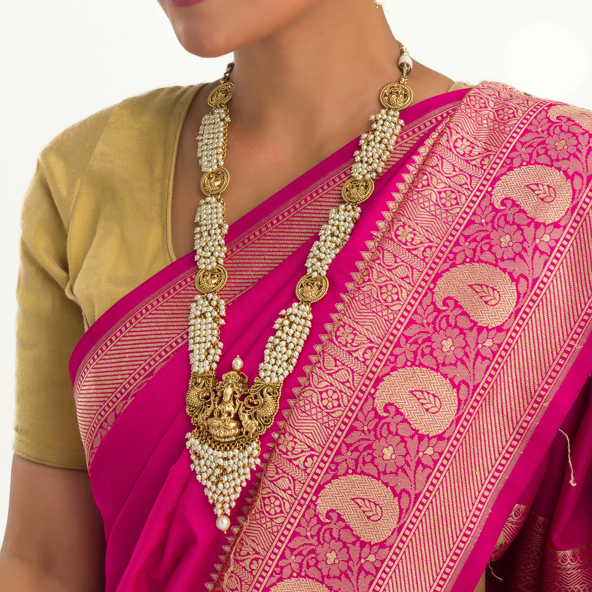 Luxurious temple long necklace with white pearls radiates opulence and refined elegance for festivals.