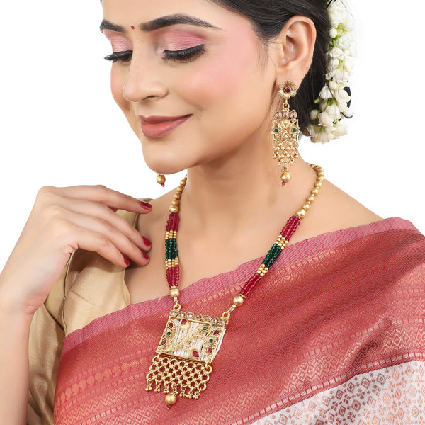 Vibrant gold long necklace with multicolor stones enhances festive attire with vibrant elegance