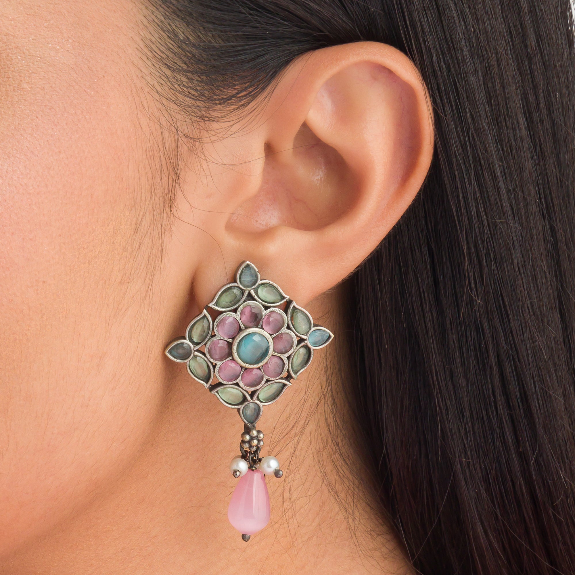 "Oxidized choker with multicolor stones adds a unique and vibrant touch for festive occasions."