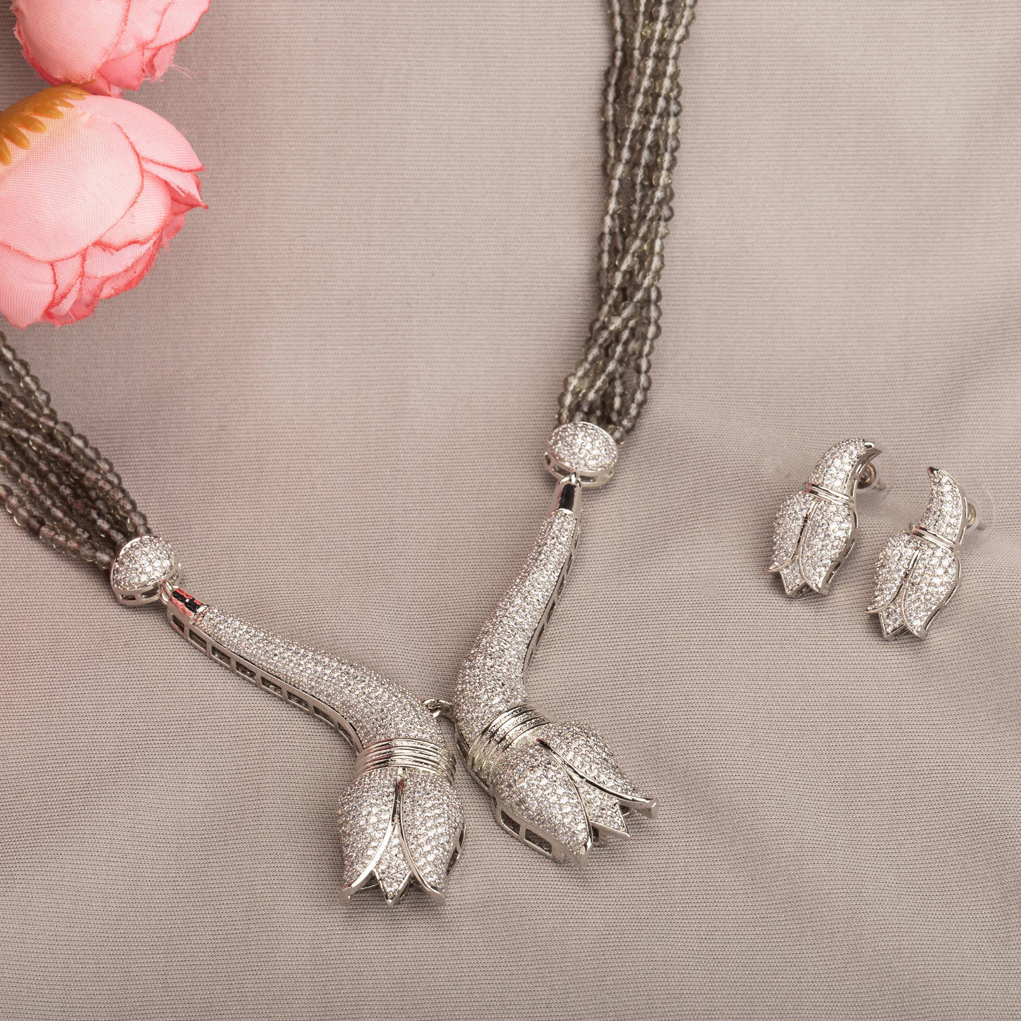 Trendy long grey zircon necklace with silver accents offers sleek, modern sophistication.