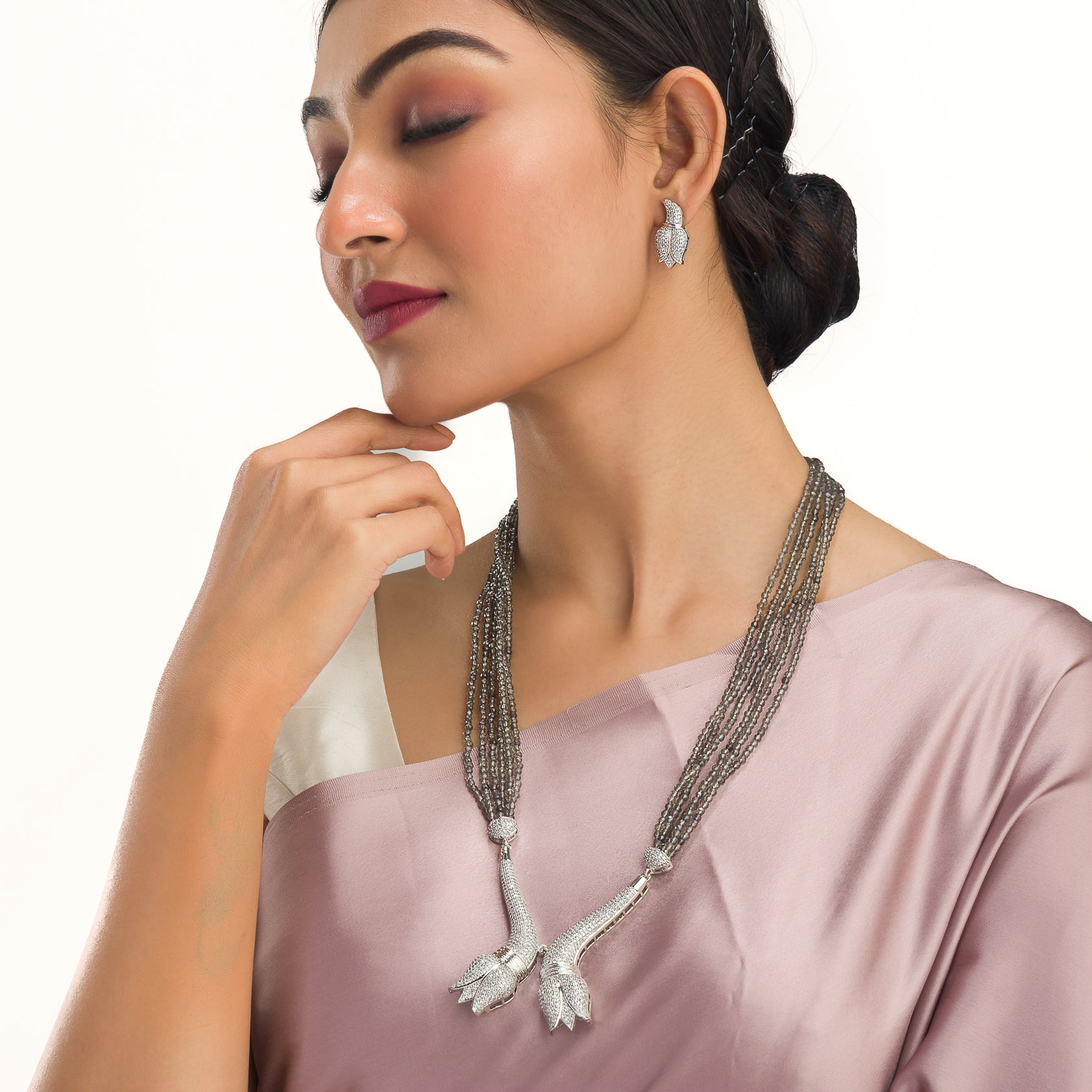 Trendy long grey zircon necklace with silver accents offers sleek, modern sophistication.
