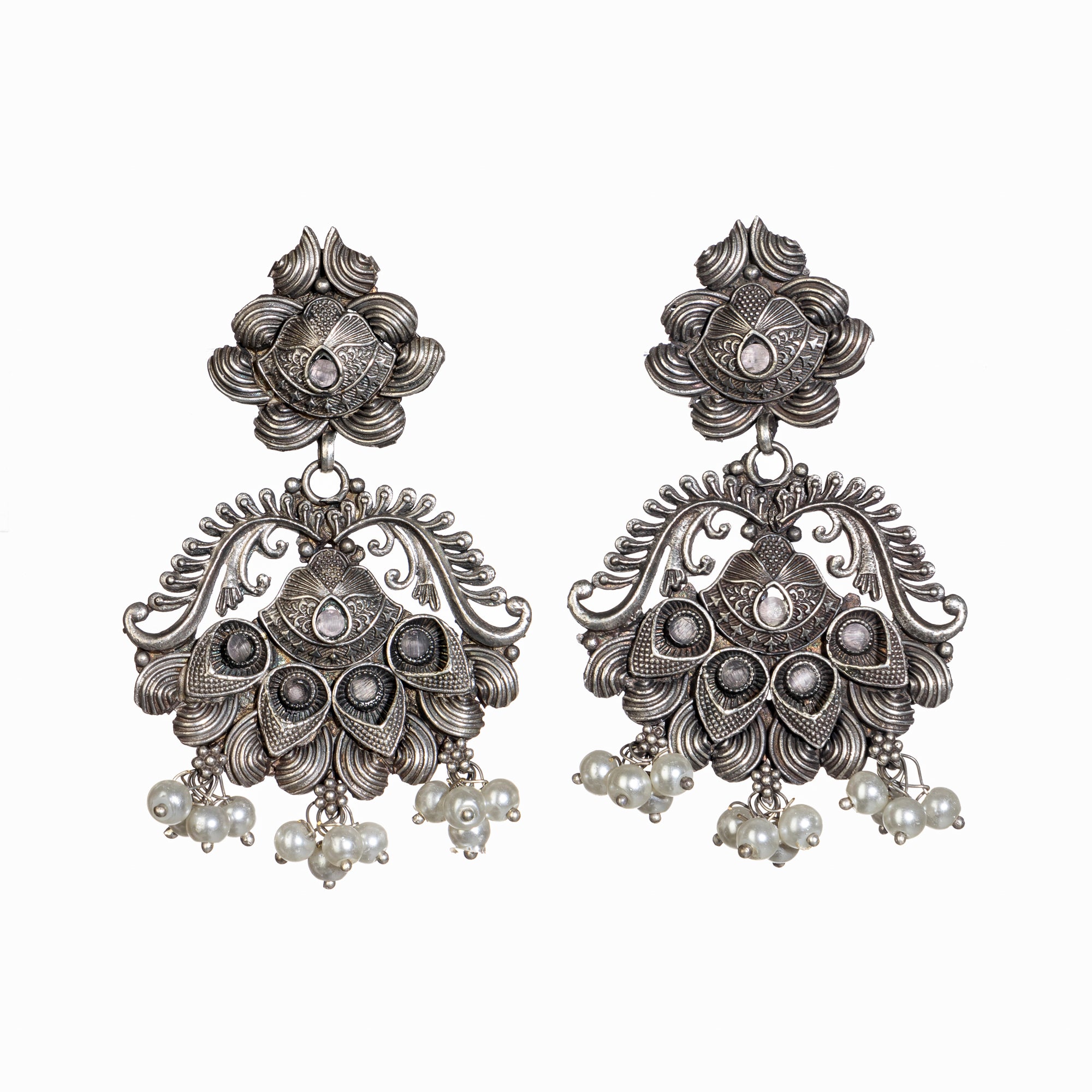 "Long oxidized necklace with pink and white pearls adds vintage elegance."