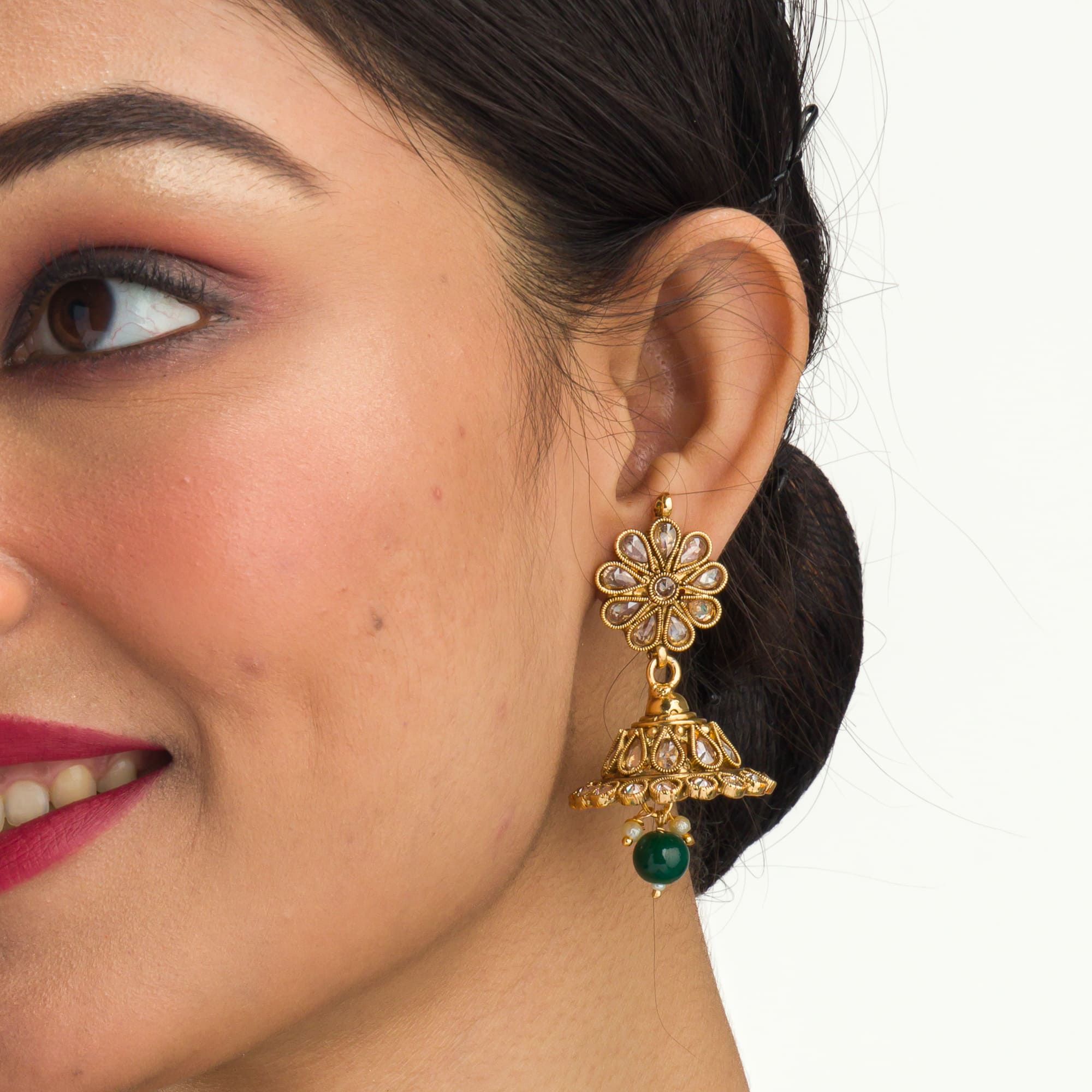 "Stylish gold-tone necklace with green Kundan for vibrant, elegant appeal."