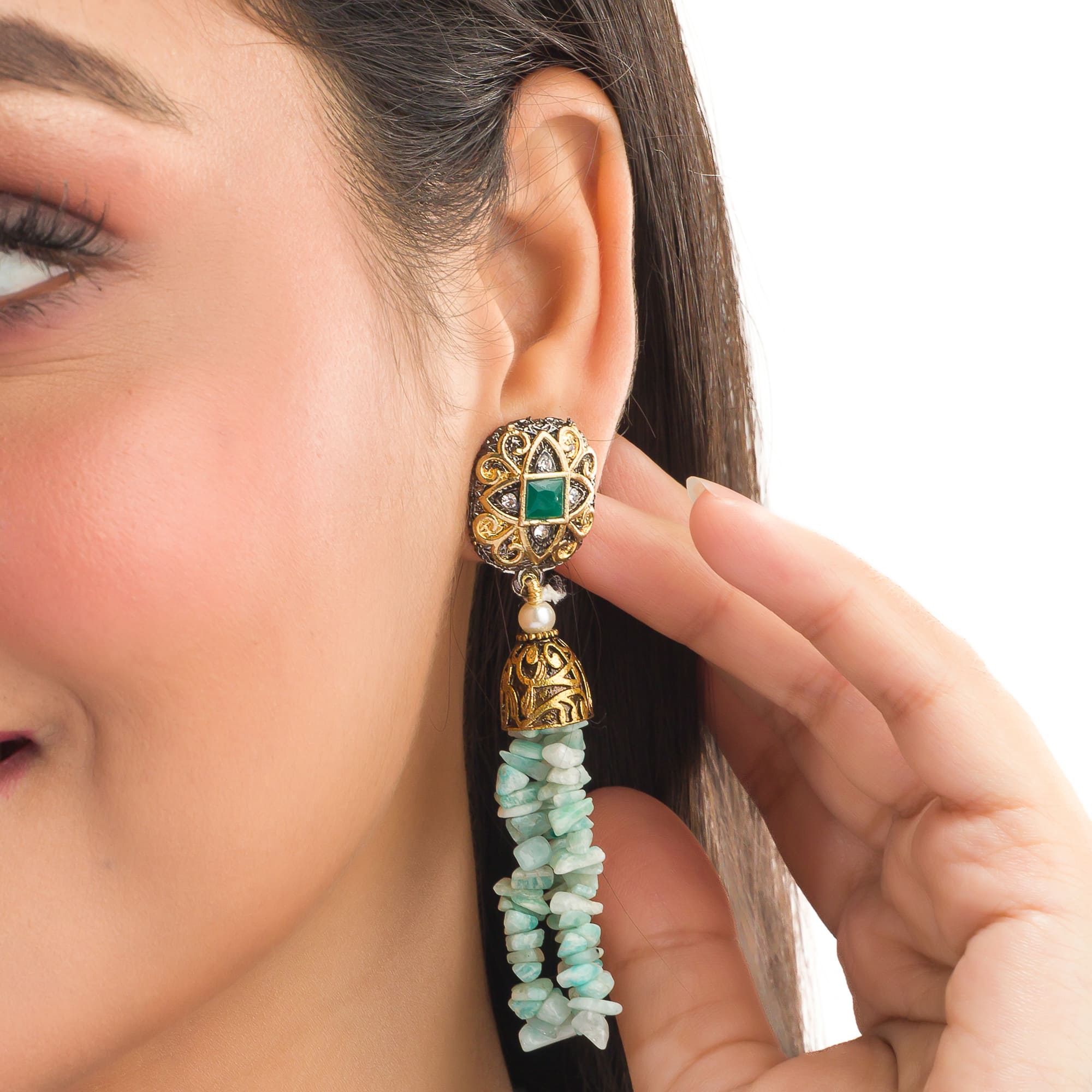 "Gold-tone long necklace with green sea stone offers a refreshing, natural touch."