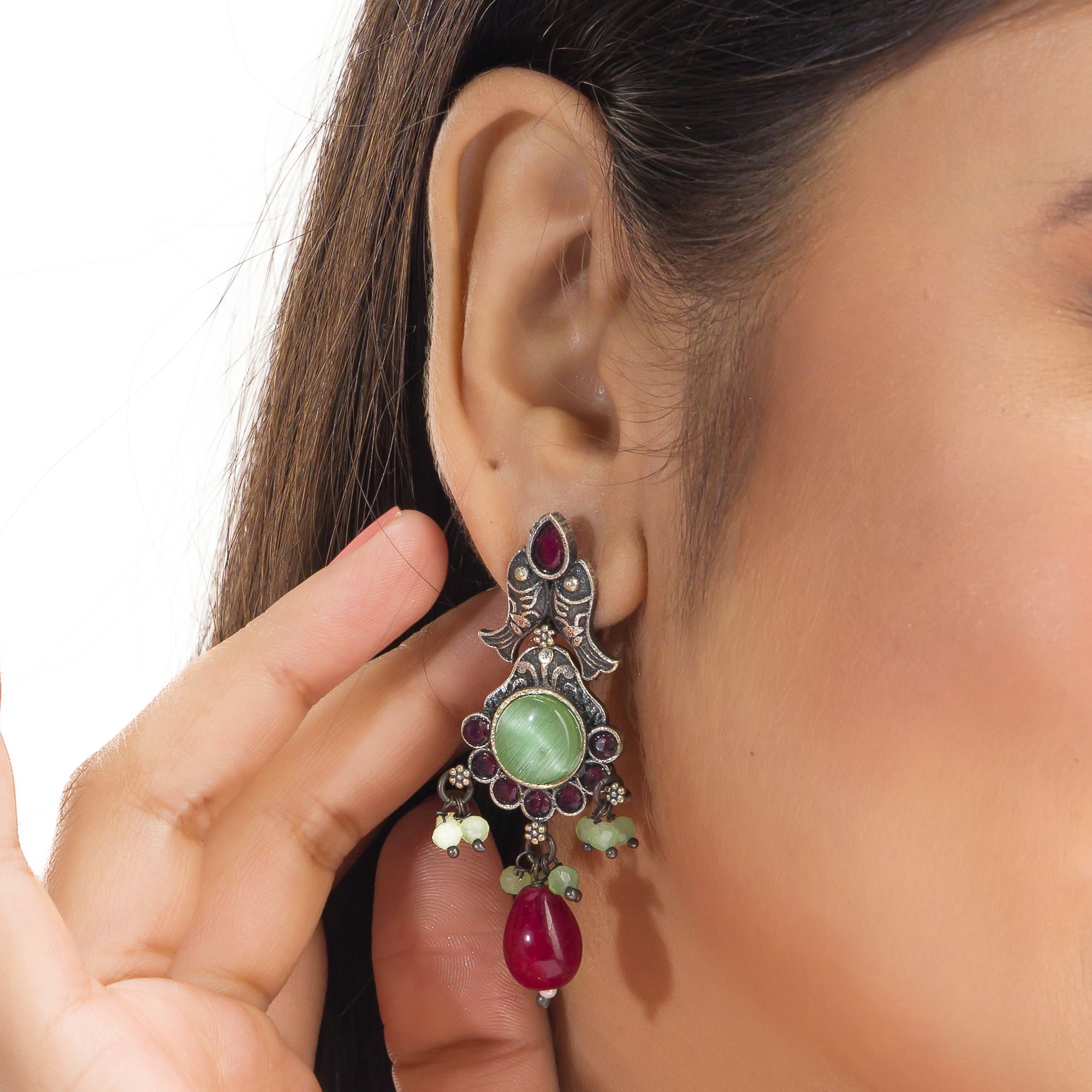 Oxidized choker with light green stones and maroon Kundan blends unique charm.