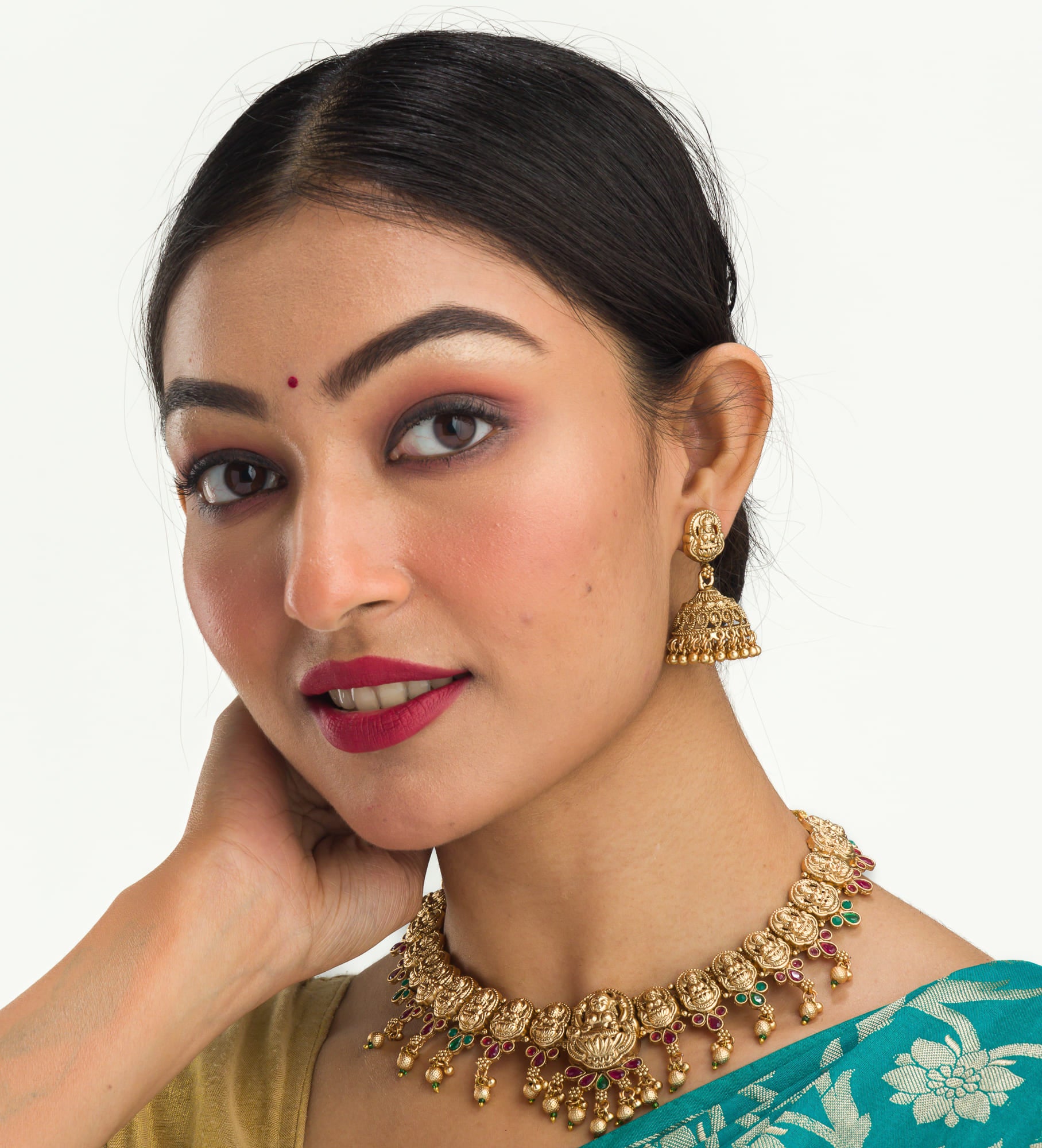 Gold-tone temple necklace set with golden beads offers timeless elegance