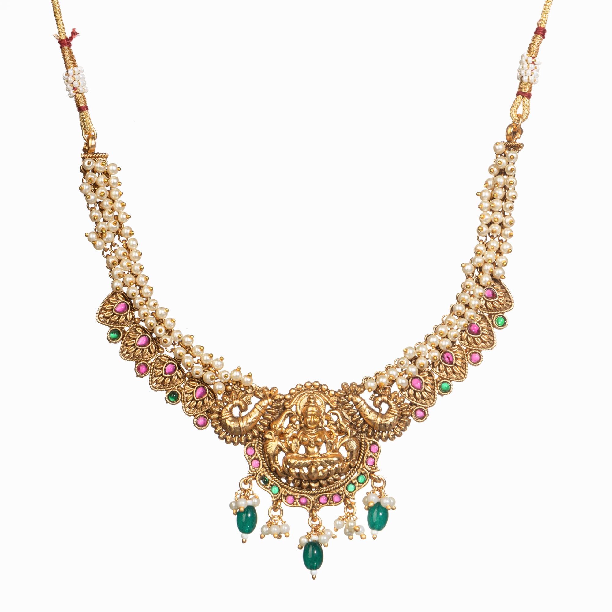 "Gold-tone necklace with white pearl and green Kundan for a timeless traditional look."