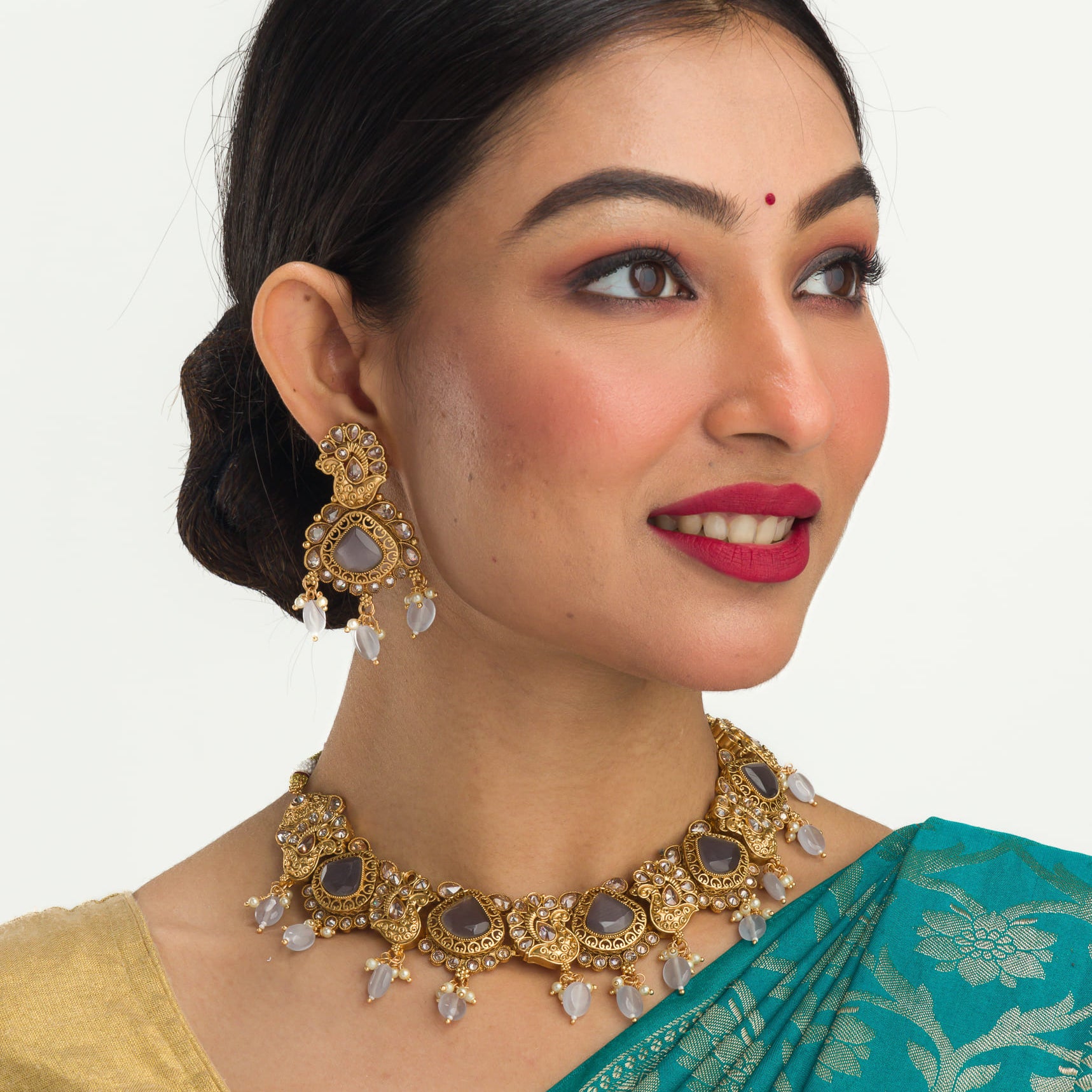 "Gold-tone necklace with grey stones and Kundan for a chic, modern appeal."