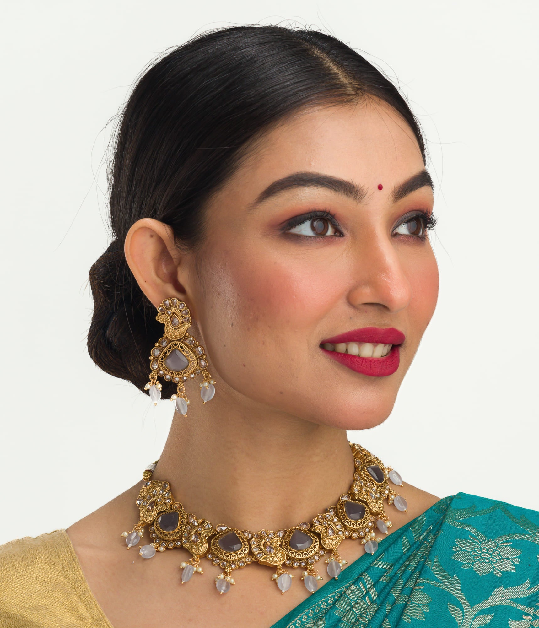 "Gold-tone necklace with grey stones and Kundan for a chic, modern appeal."
