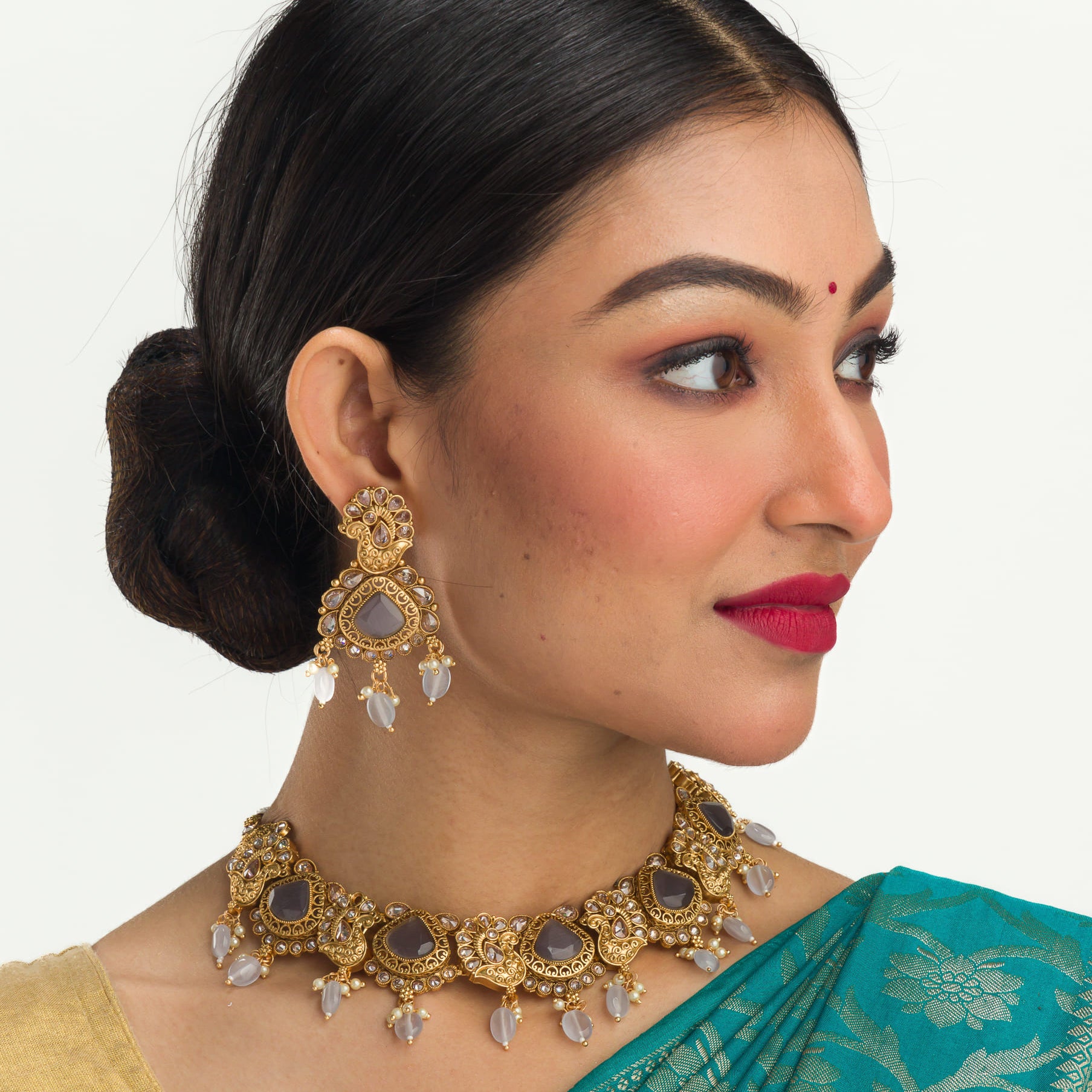 "Gold-tone necklace with grey stones and Kundan for a chic, modern appeal."