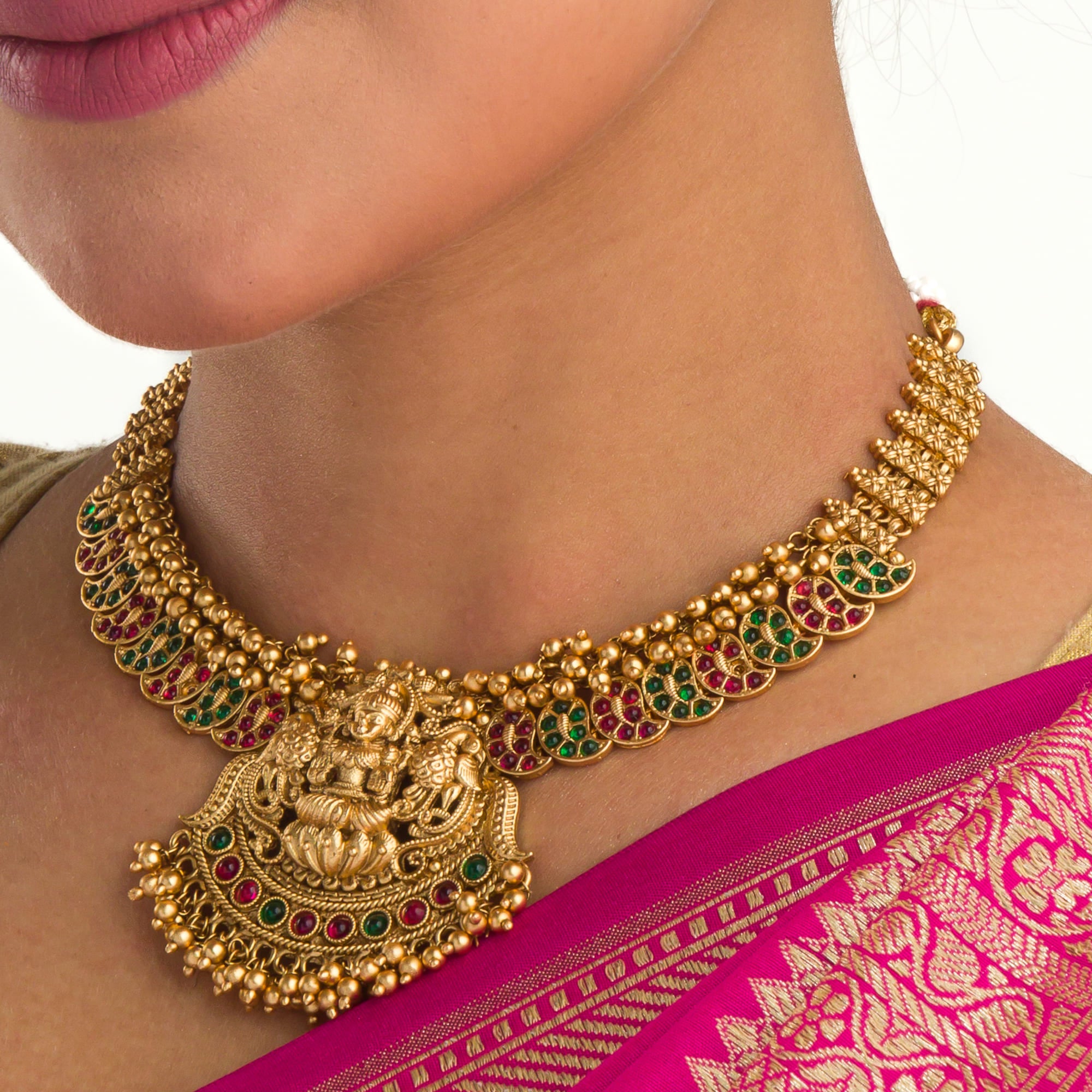 Traditional short temple necklace set, showcasing intricate craftsmanship and charm.