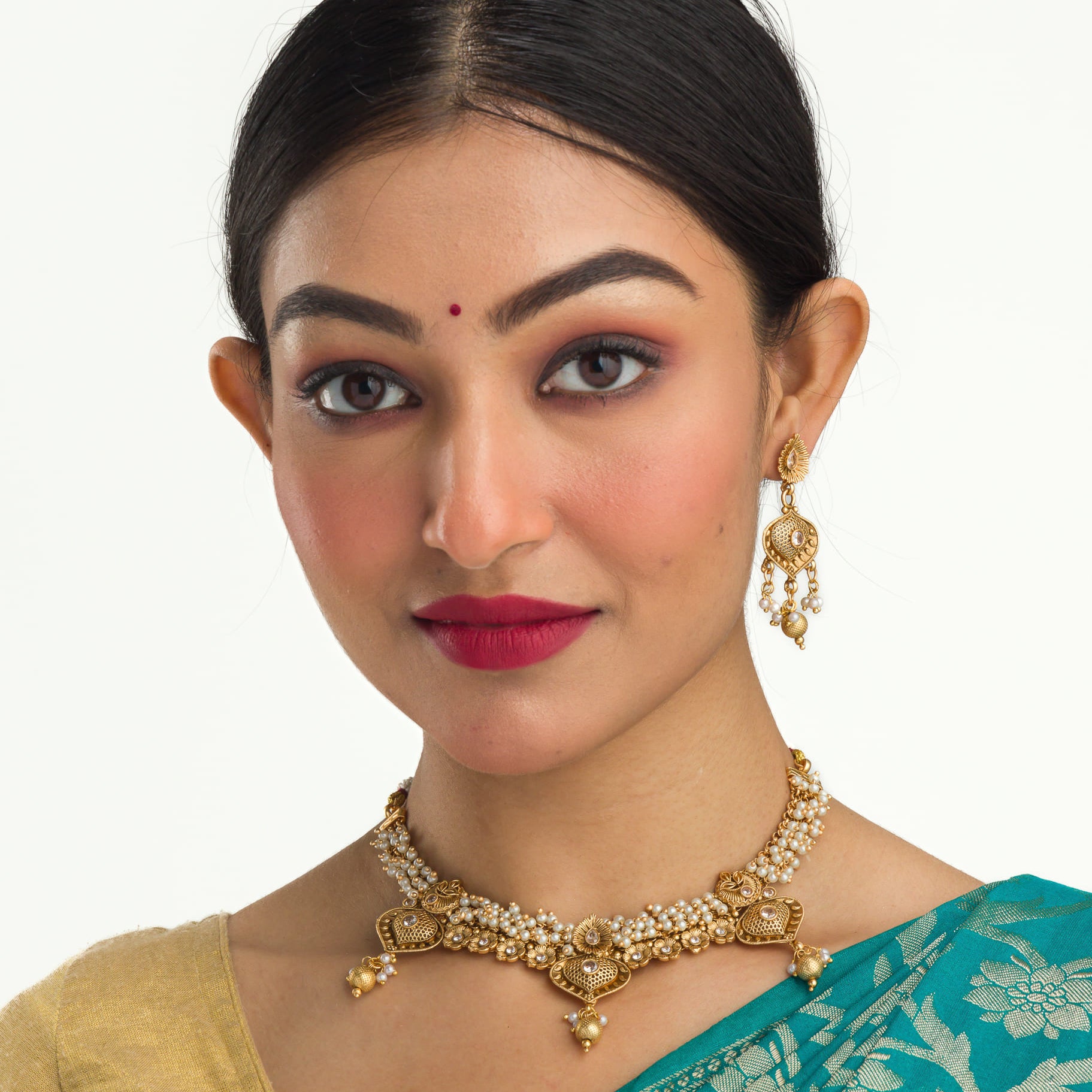 "Elegant goldtone necklace with lustrous pearls for timeless sophistication."