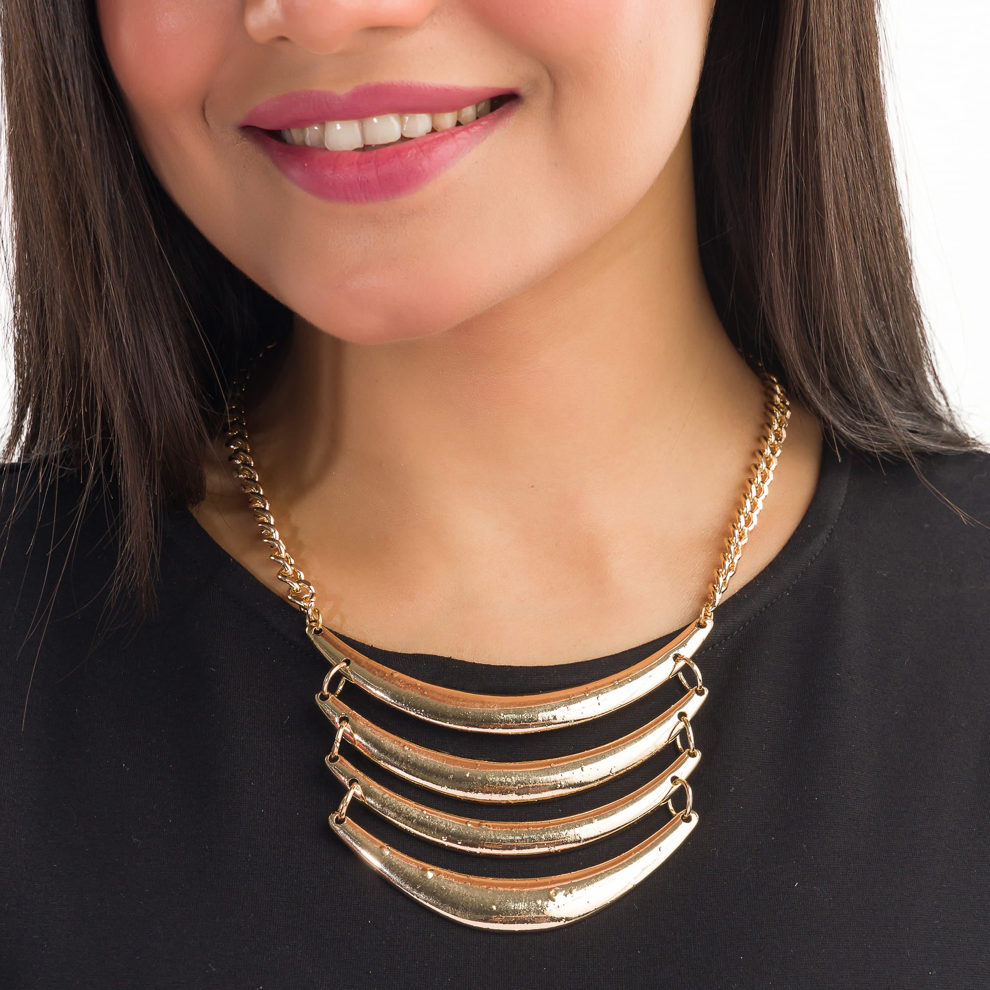 "Trendy gold-tone necklace adds a chic touch to any casual look."