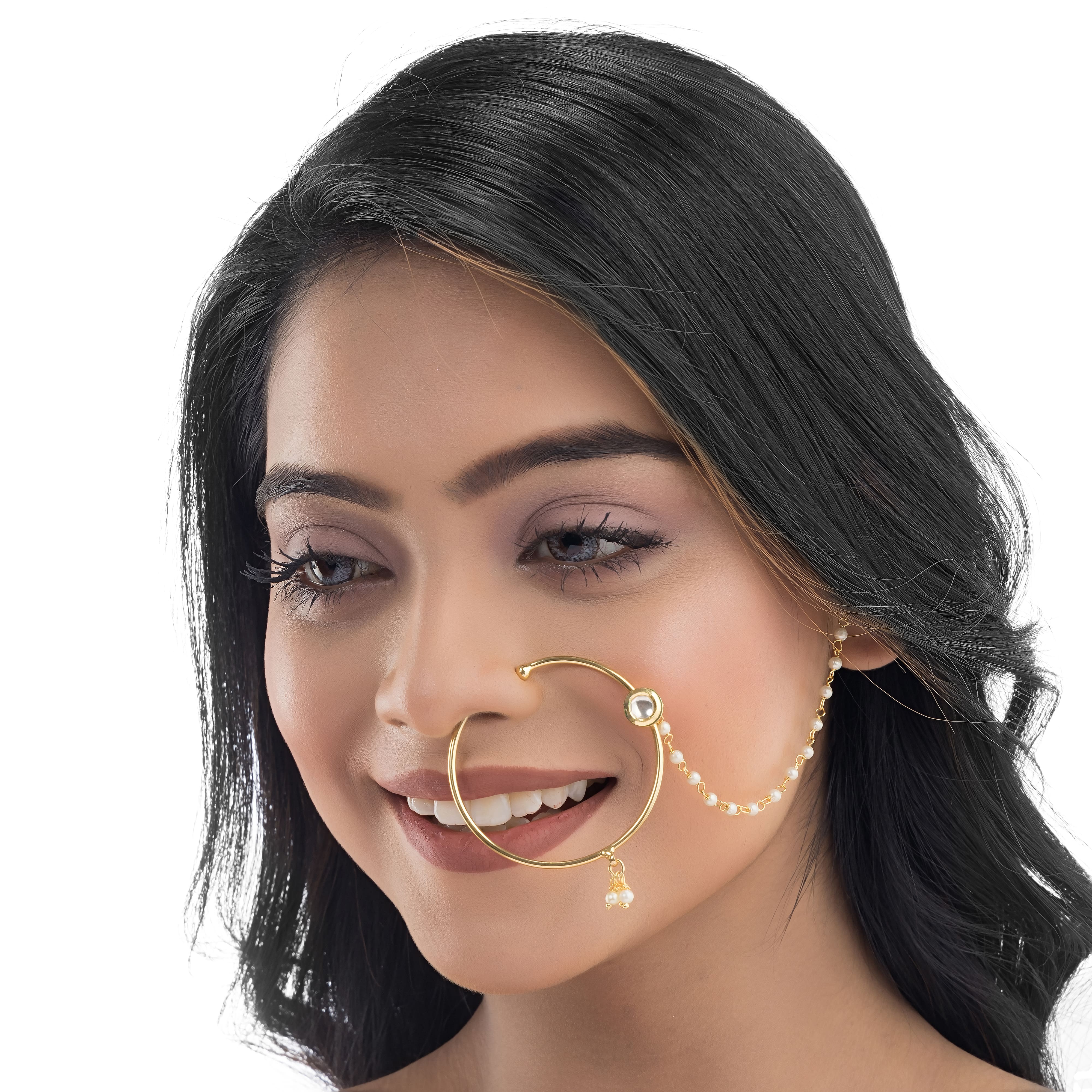 "Gold-polish nath with white pearls offers classic, elegant charm."