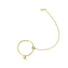 "Gold-polish nath with white pearls offers classic, elegant charm."