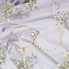 "Gold-polish nath with white pearls offers classic, elegant charm."