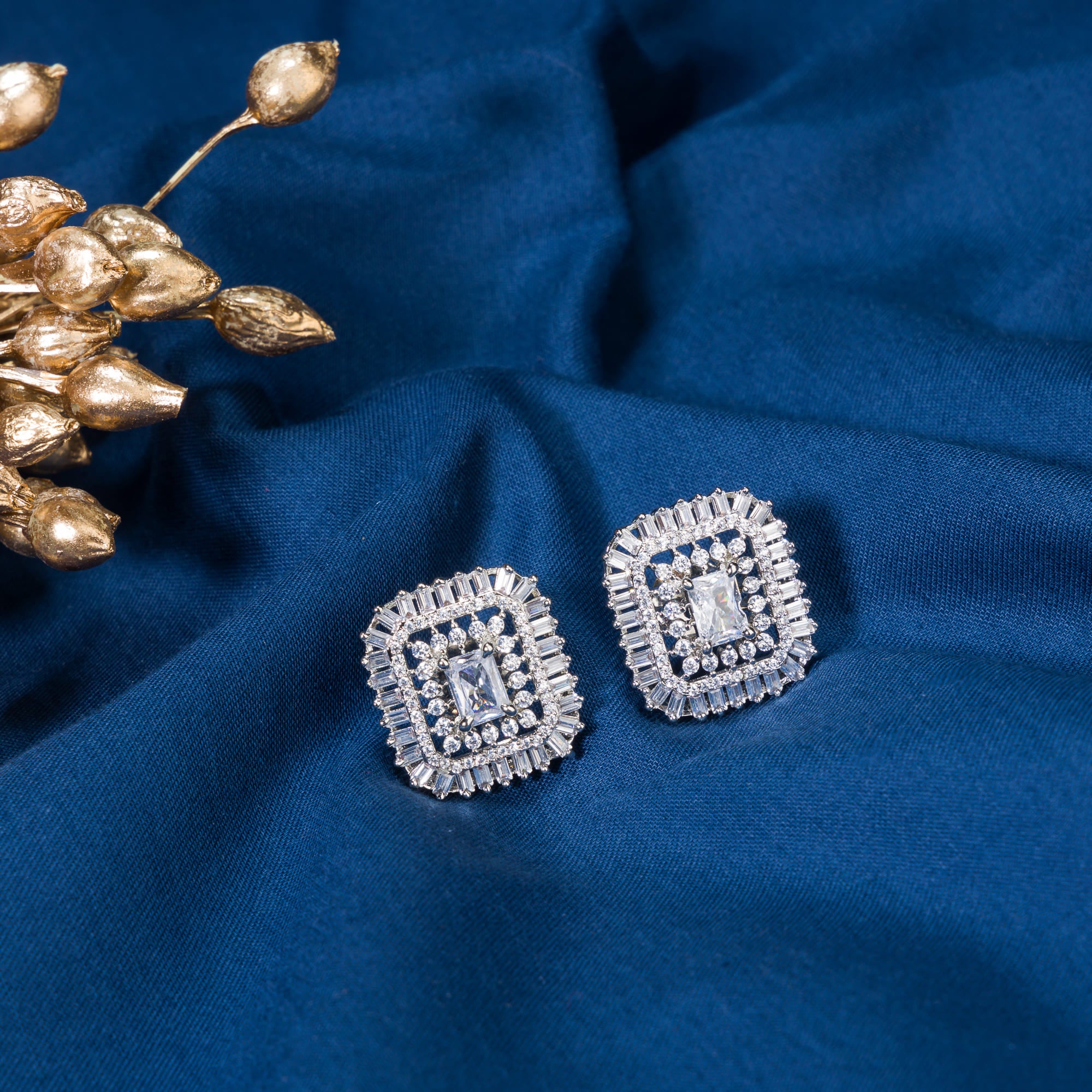 Square zircon stud earrings provide sleek, modern sparkle.